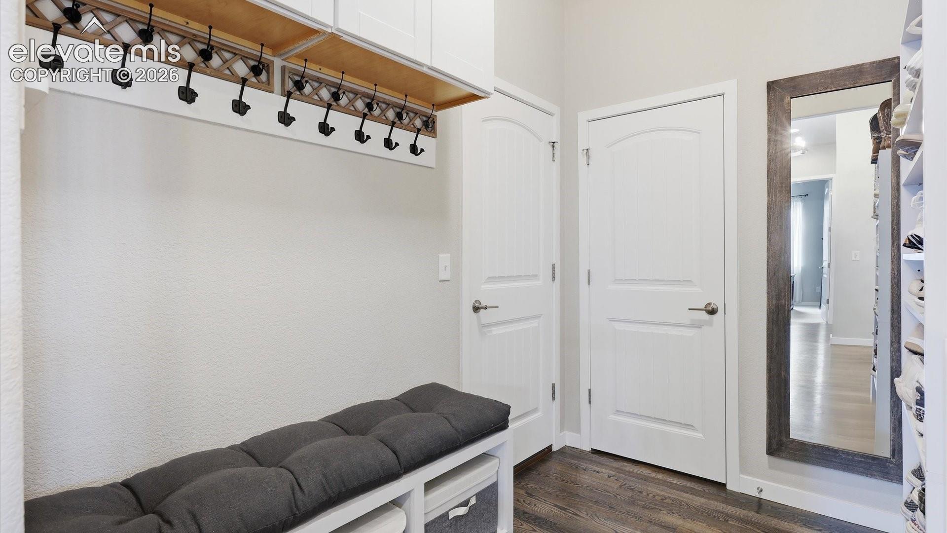 SMART DESIGN, BEAUTIFULLY EXECUTED — An inviting mudroom off the garage keeps everyday essentials organized while providing seamless access to the laundry room.