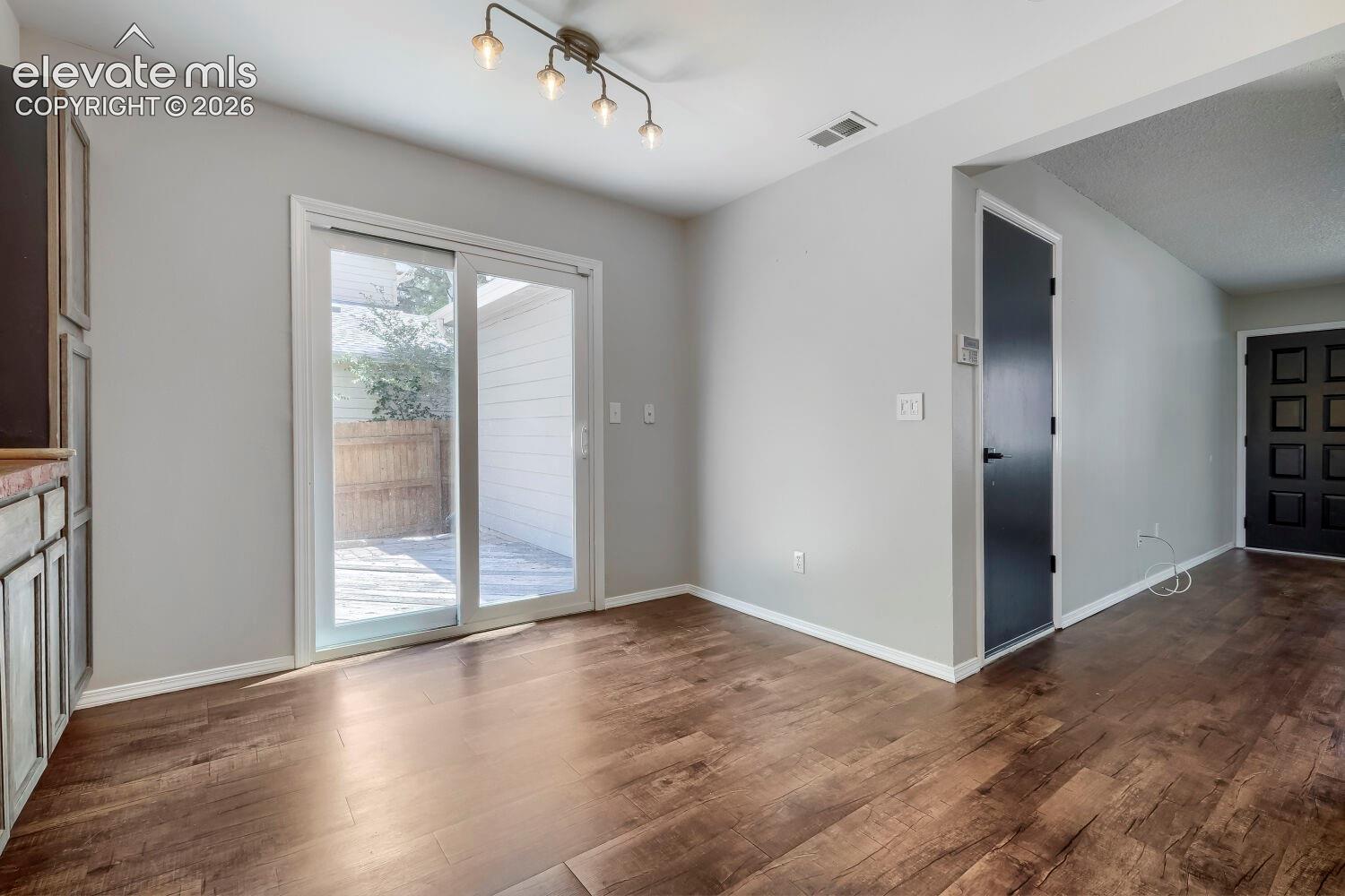 Dining space featuring wood-finish flooring