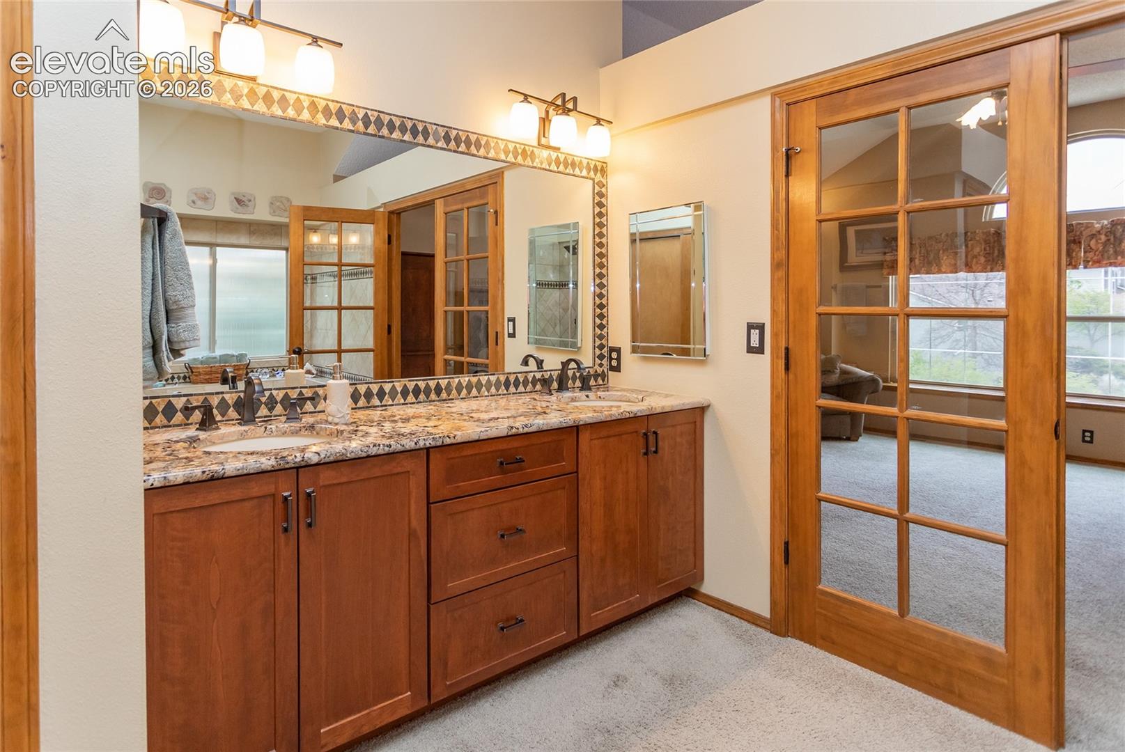 Primary Bathroom Double Vanity and Granite Countertop