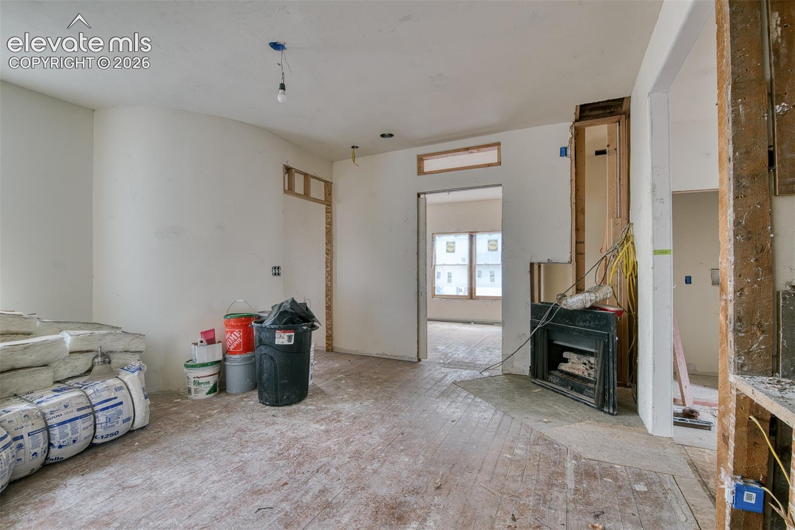 Living Room. Kitchen and dining is to the right. Primary bedroom is straight ahead. 