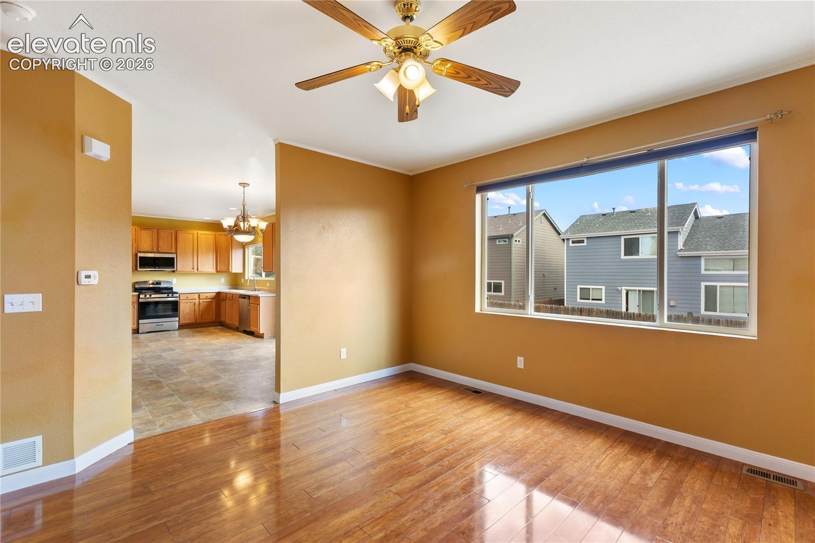 Kitchen flows into dining room and walks out.