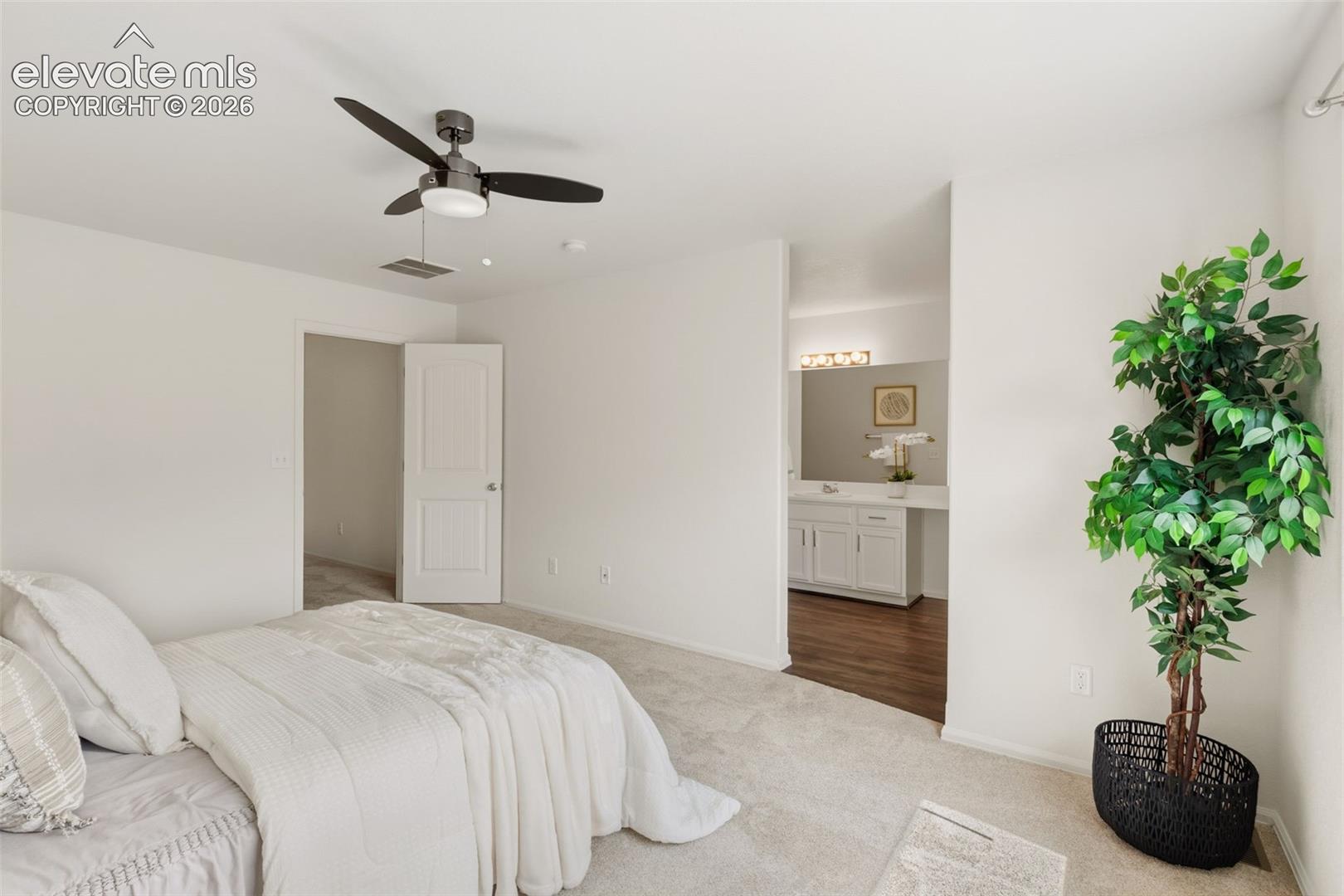 Retreat to your private primary suite, complete with an adjoining full bathroom for ultimate relaxation