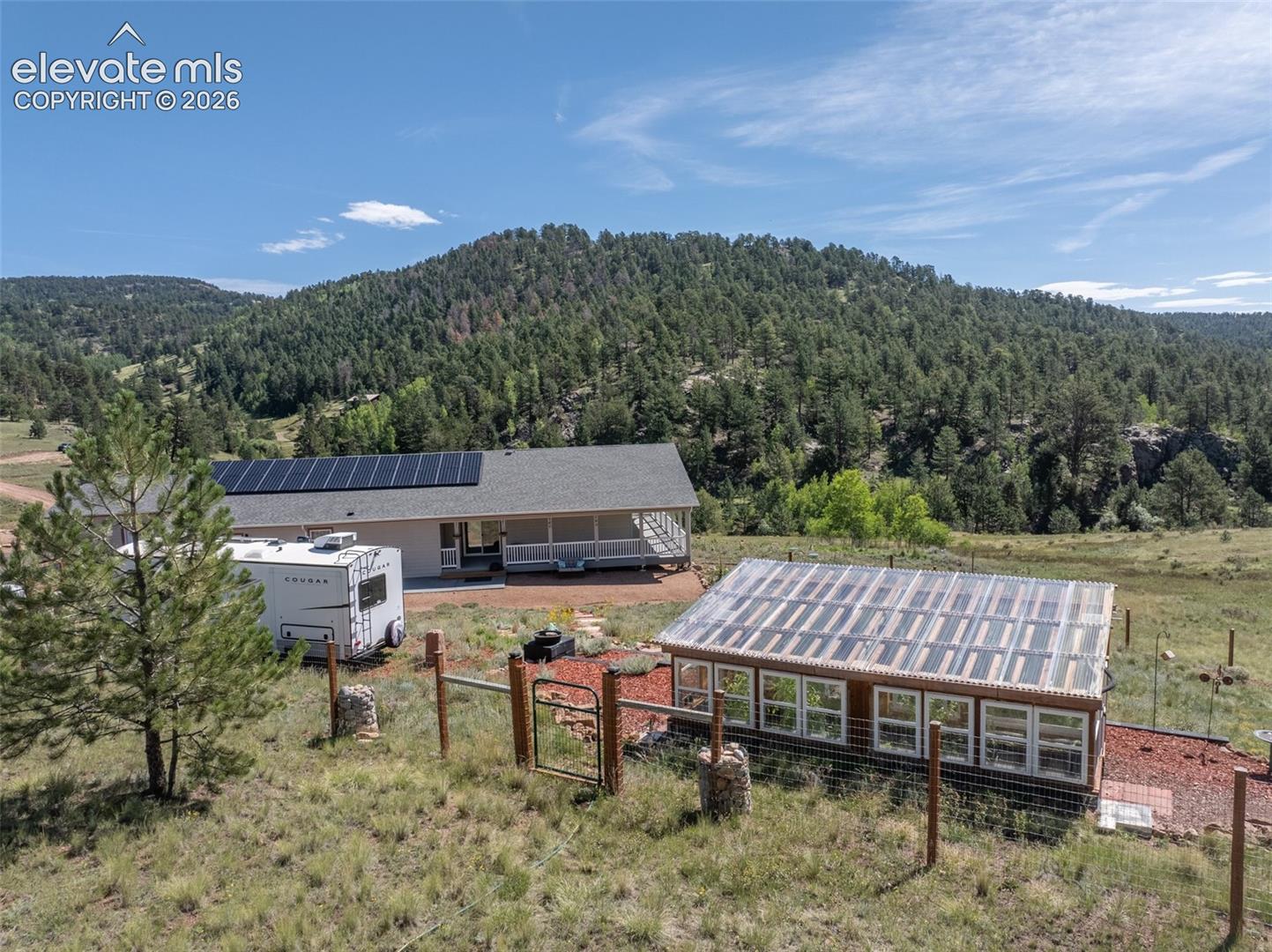 Mountain views with pines and aspens. 