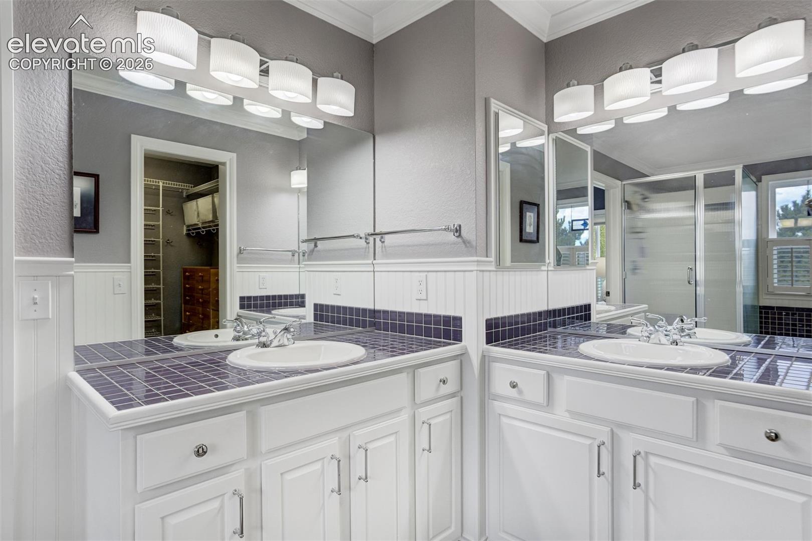 Primary bath features a 5 piece bath and walk-in closet