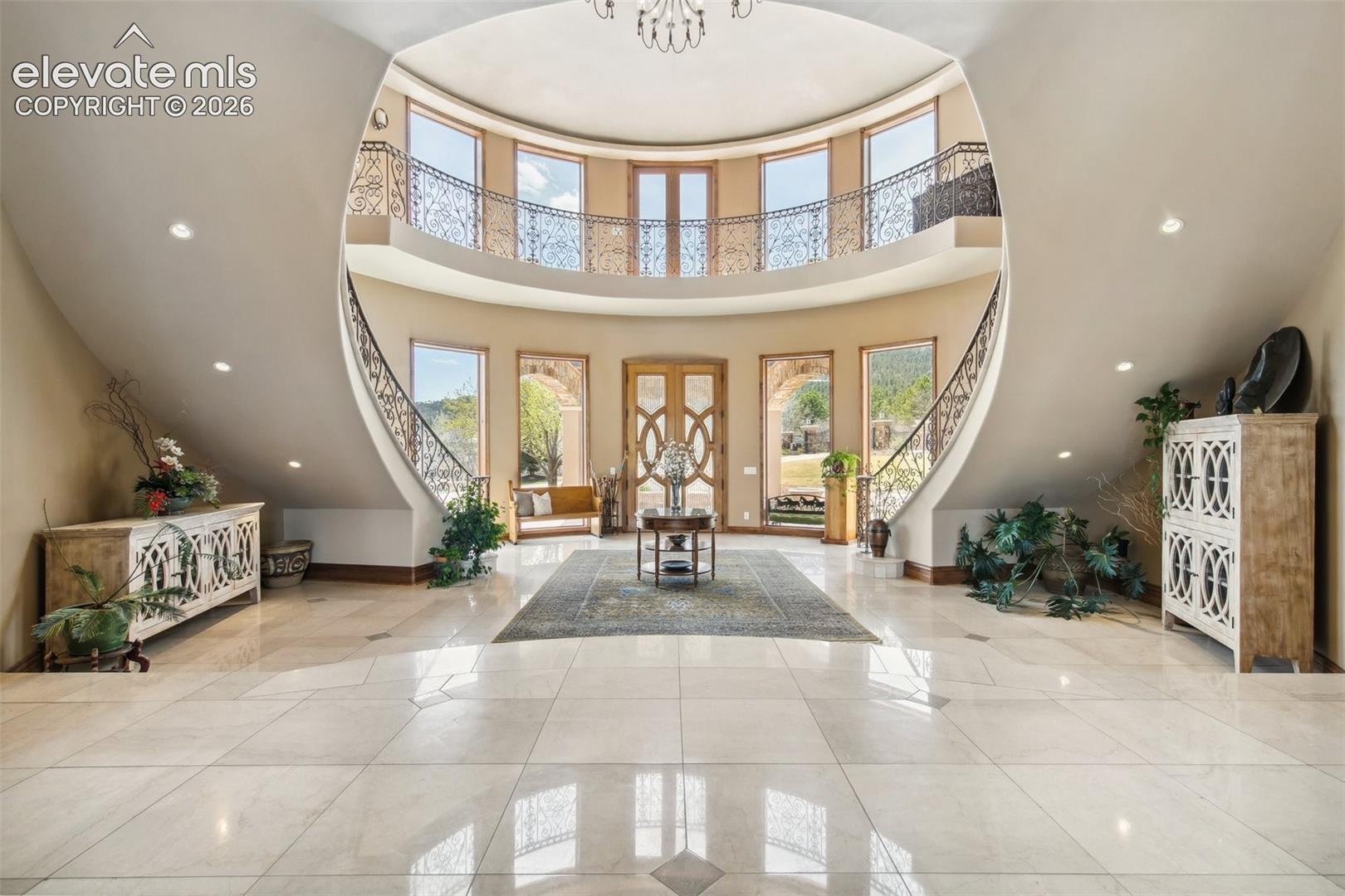 Rotunda-style foyer with suspended arch ceiling