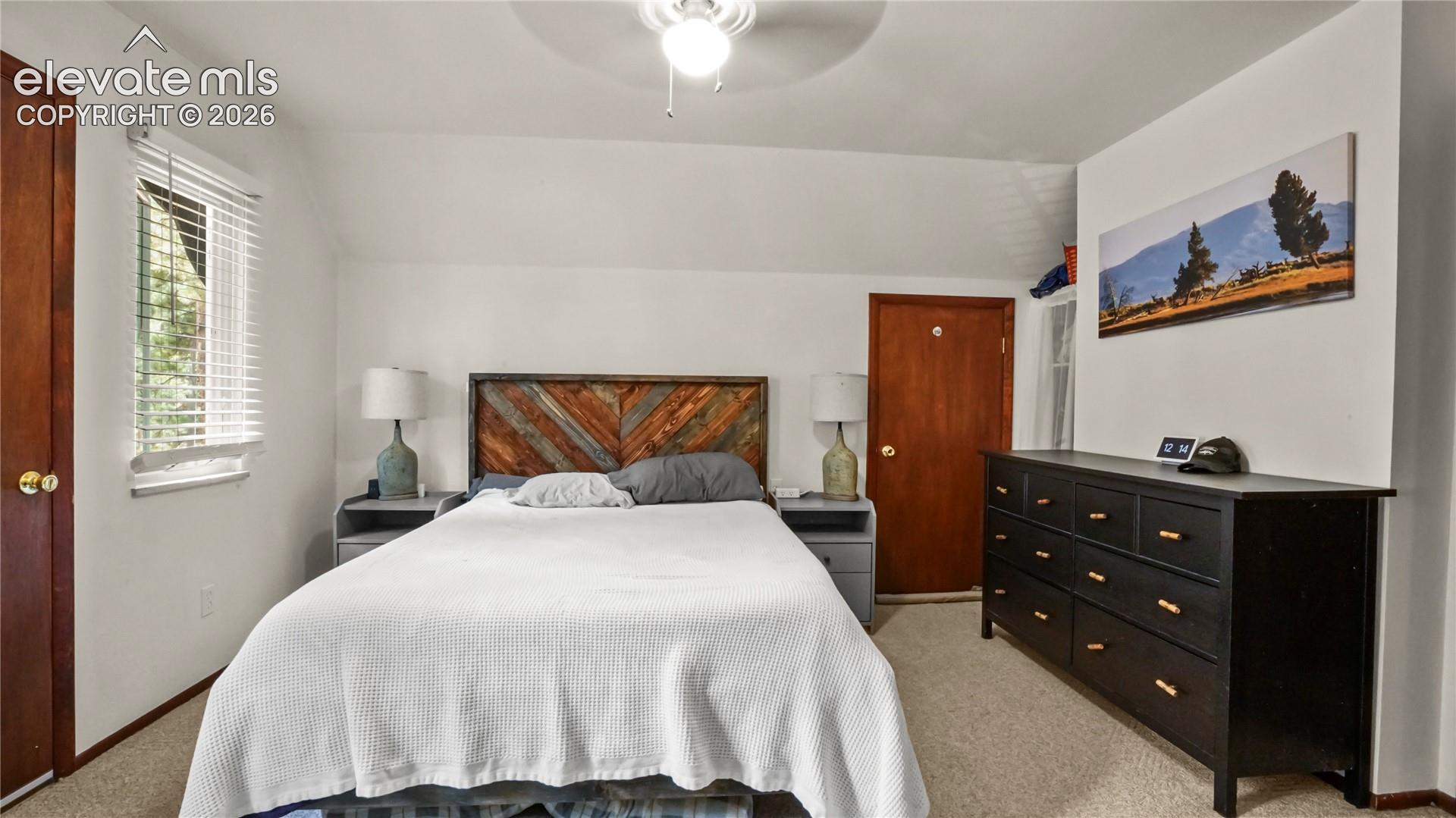 Upstairs Master Bedroom with a walk out to the separate balcony.