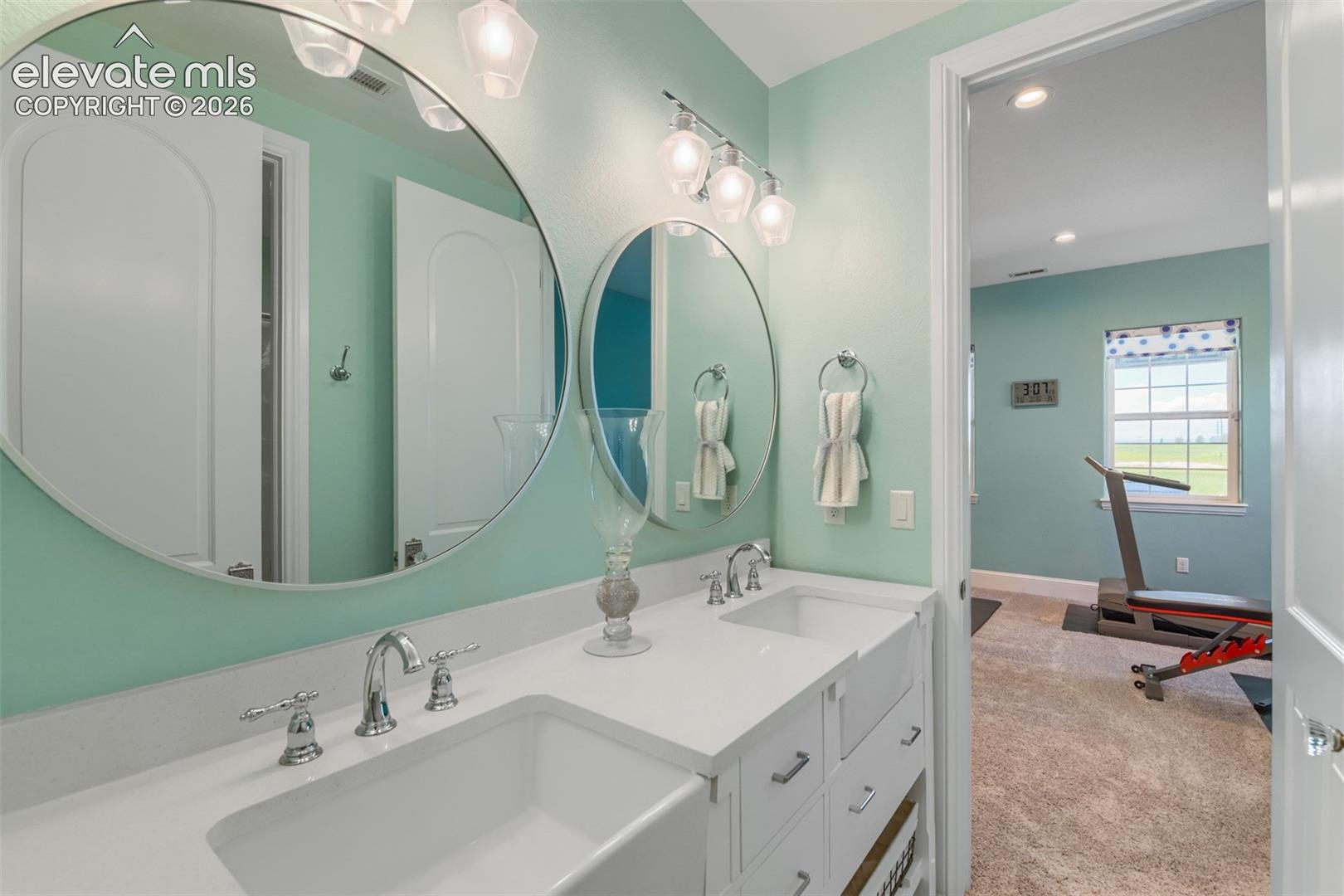 Double sink basement bath off of exercise area