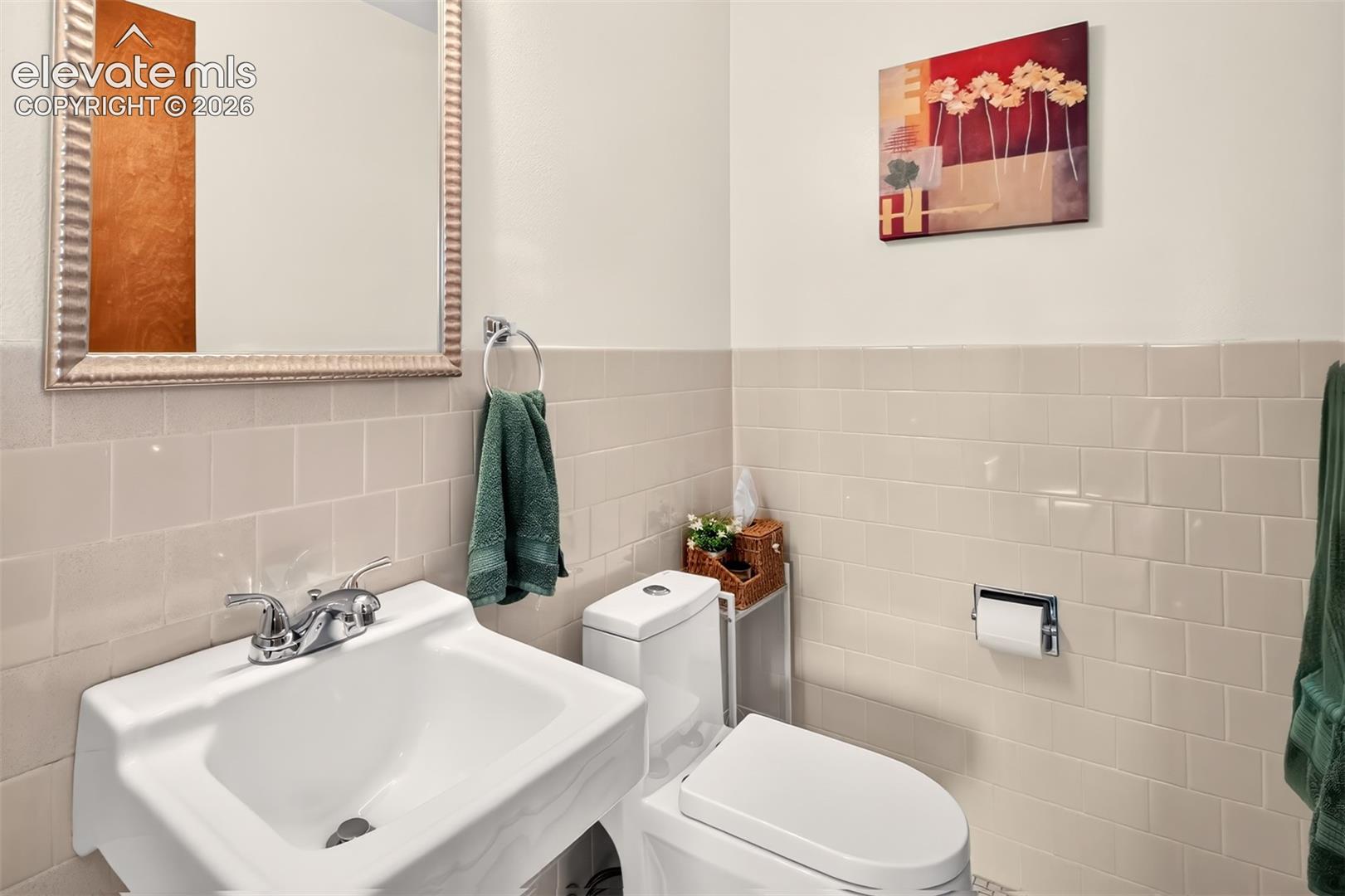 A half bath is tucked in between the dining room and kitchen