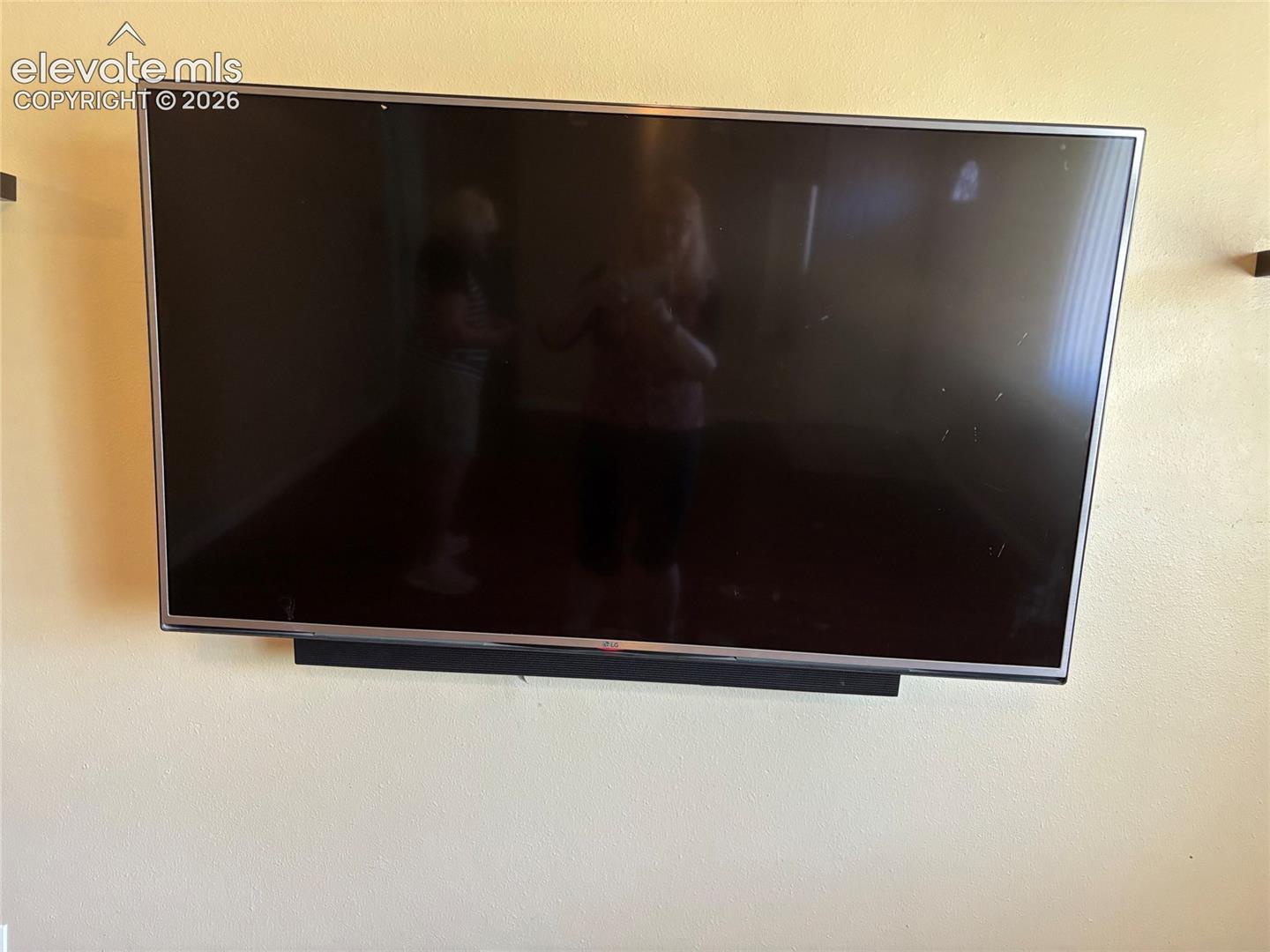 Living room has a large screen tv with sound bar, included!

