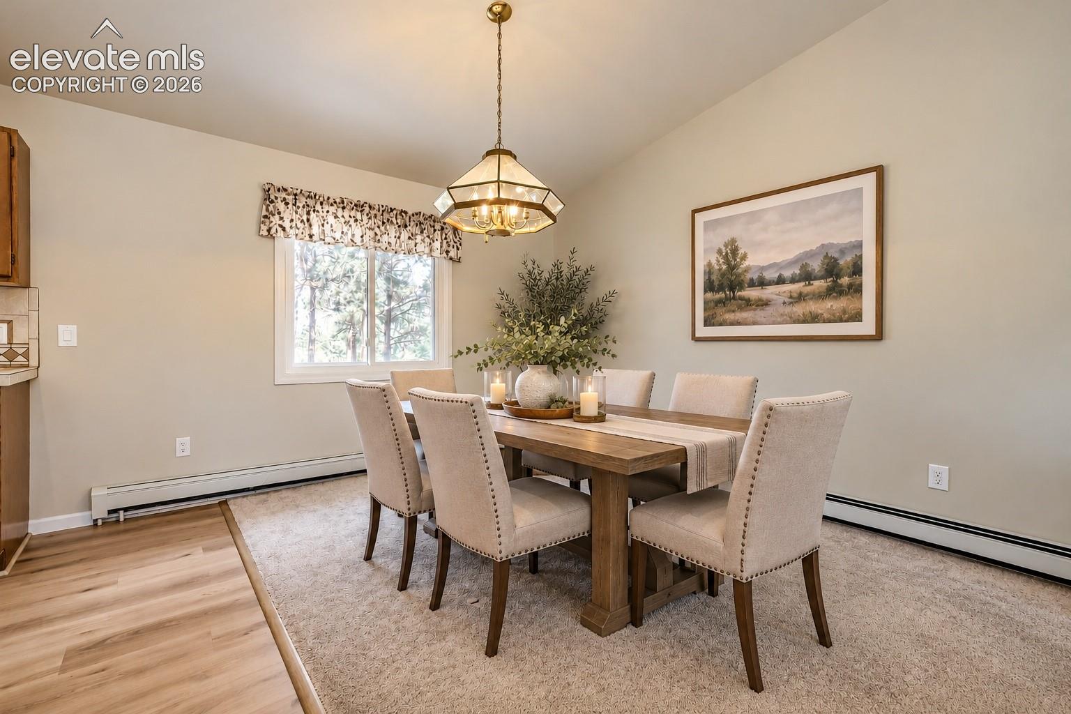 Sloped ceiling with an ornate pendant light fixture