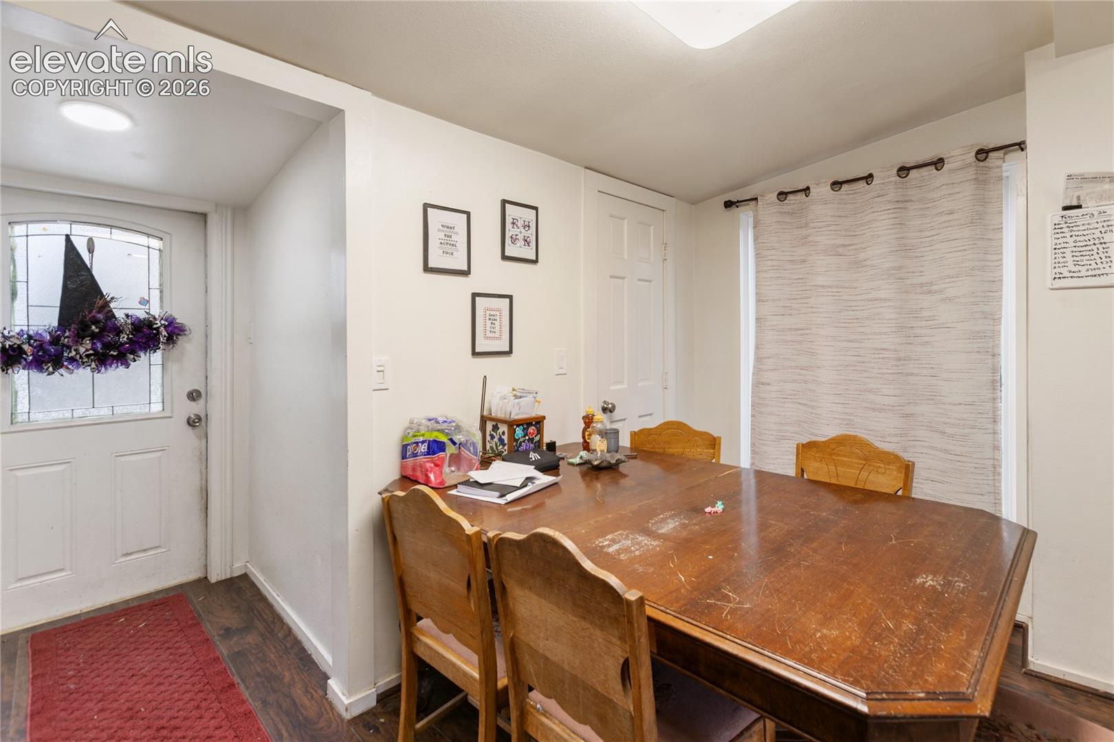 Entryway featuring a solid door with decorative glass inlay, wood-finish flooring, and recessed ceiling lighting