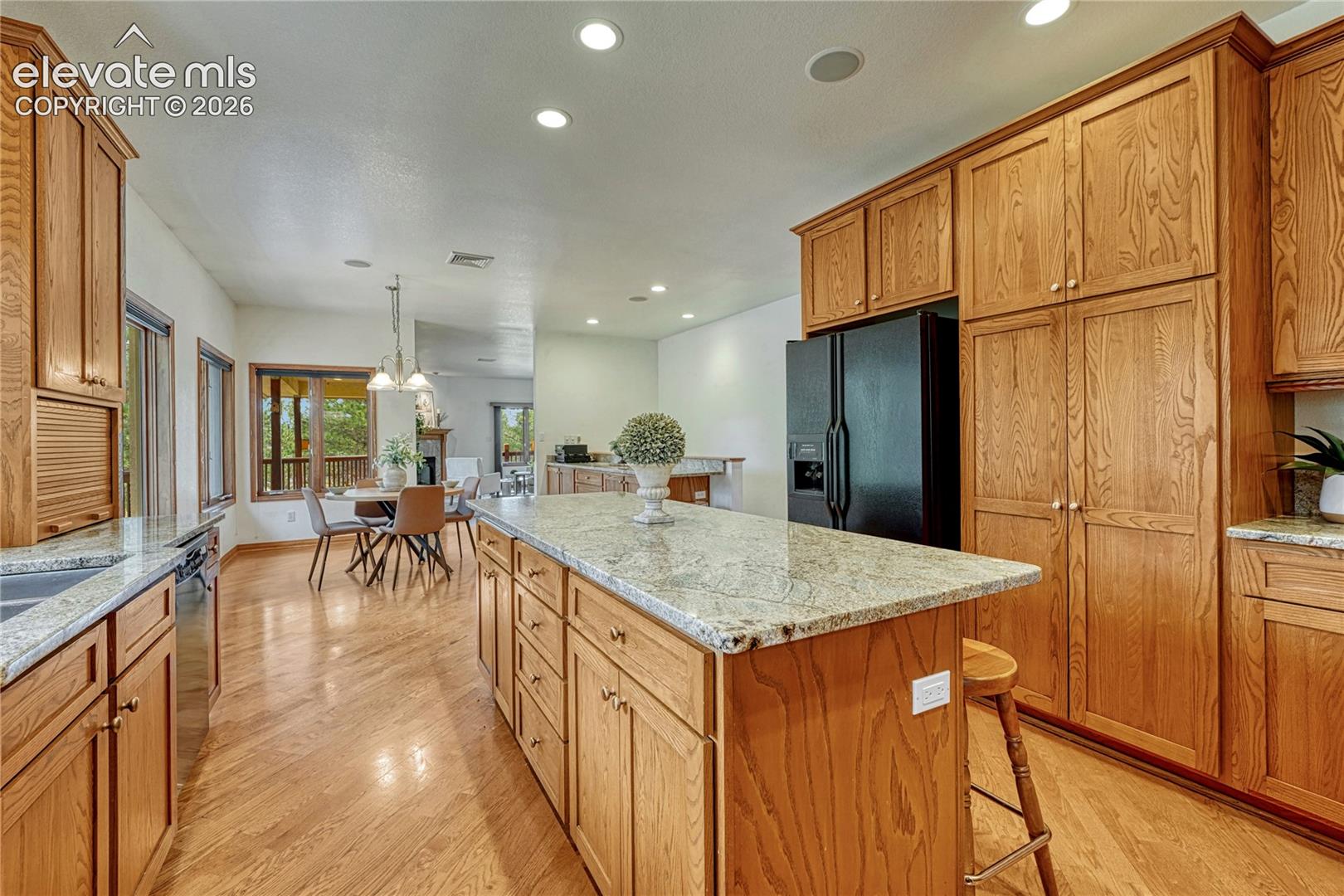 Beautiful wood cabinetry with granite countertops.