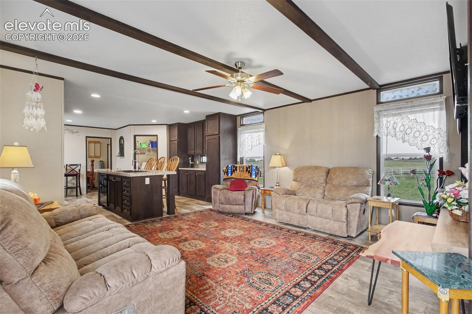 2nd Home: Living room with an open connection to the kitchen, creating a comfortable flow for everyday living and entertaining.
