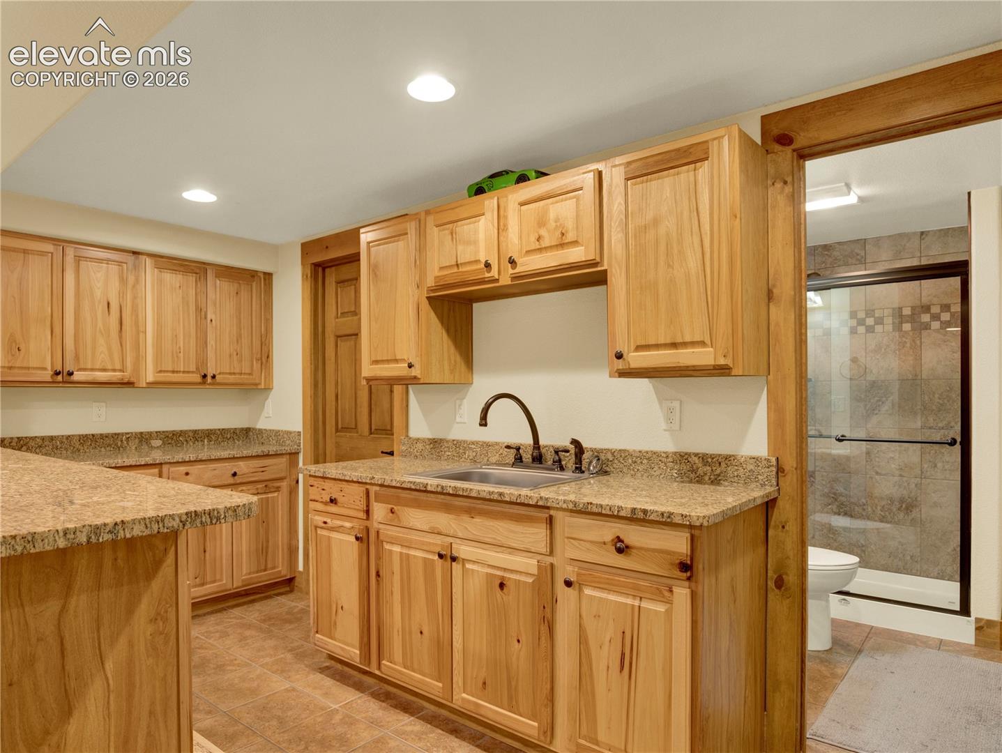 Full Wet bar followed by a 3/4 bathroom