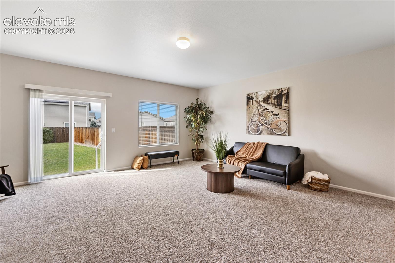 The living room is very spacious - features brand new carpeting with upgraded pad, freshly painted throughout and walks out to the level, fenced backyard