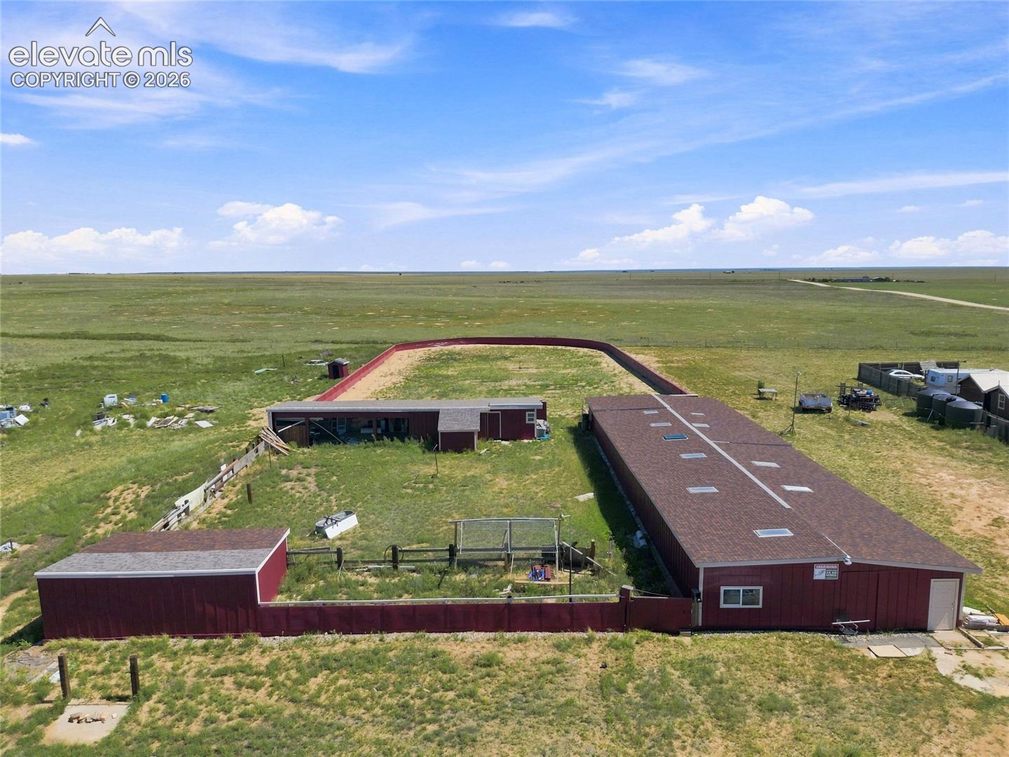 Large horse stable pictured, horse arena/run pictured, chicken coop pictured, additional sheds/storage areas pictured.