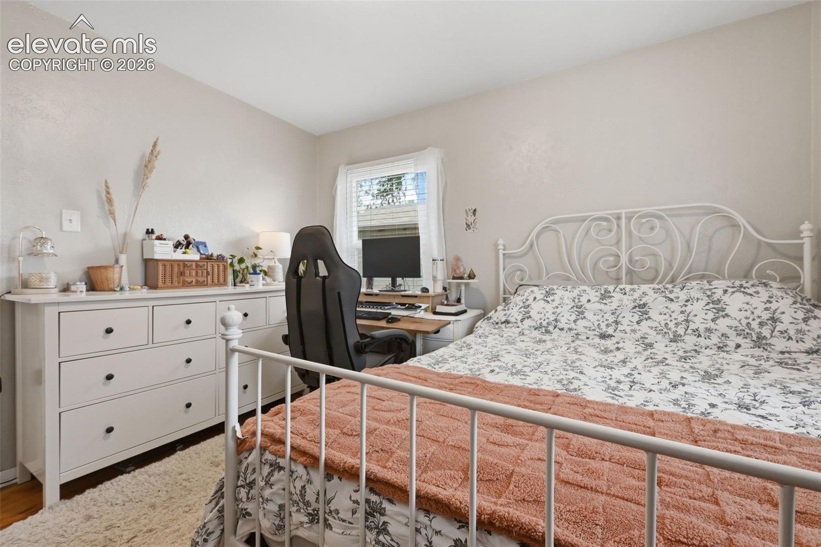 Neutral paint finishes, window with natural illumination, and wood-finish flooring