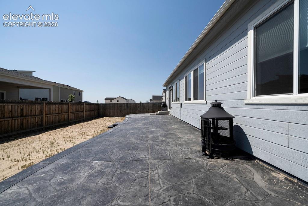 Expansive stamped concrete patio with direct access to the home
