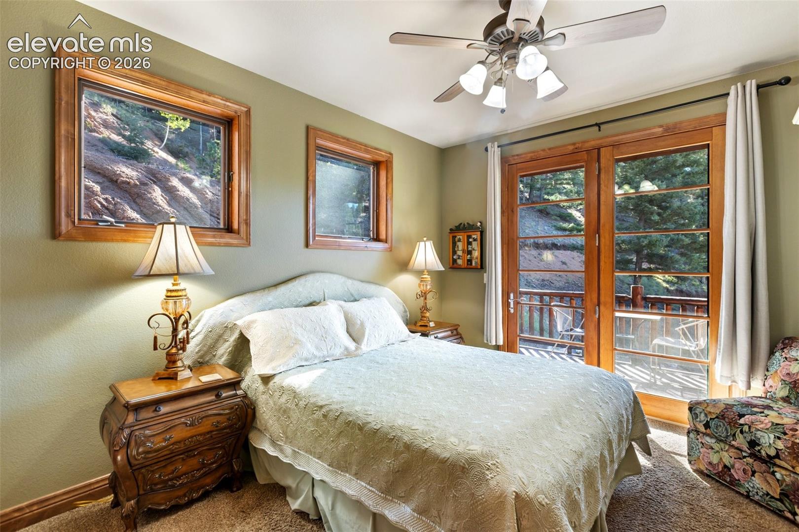 Main level bedroom w/ private deck