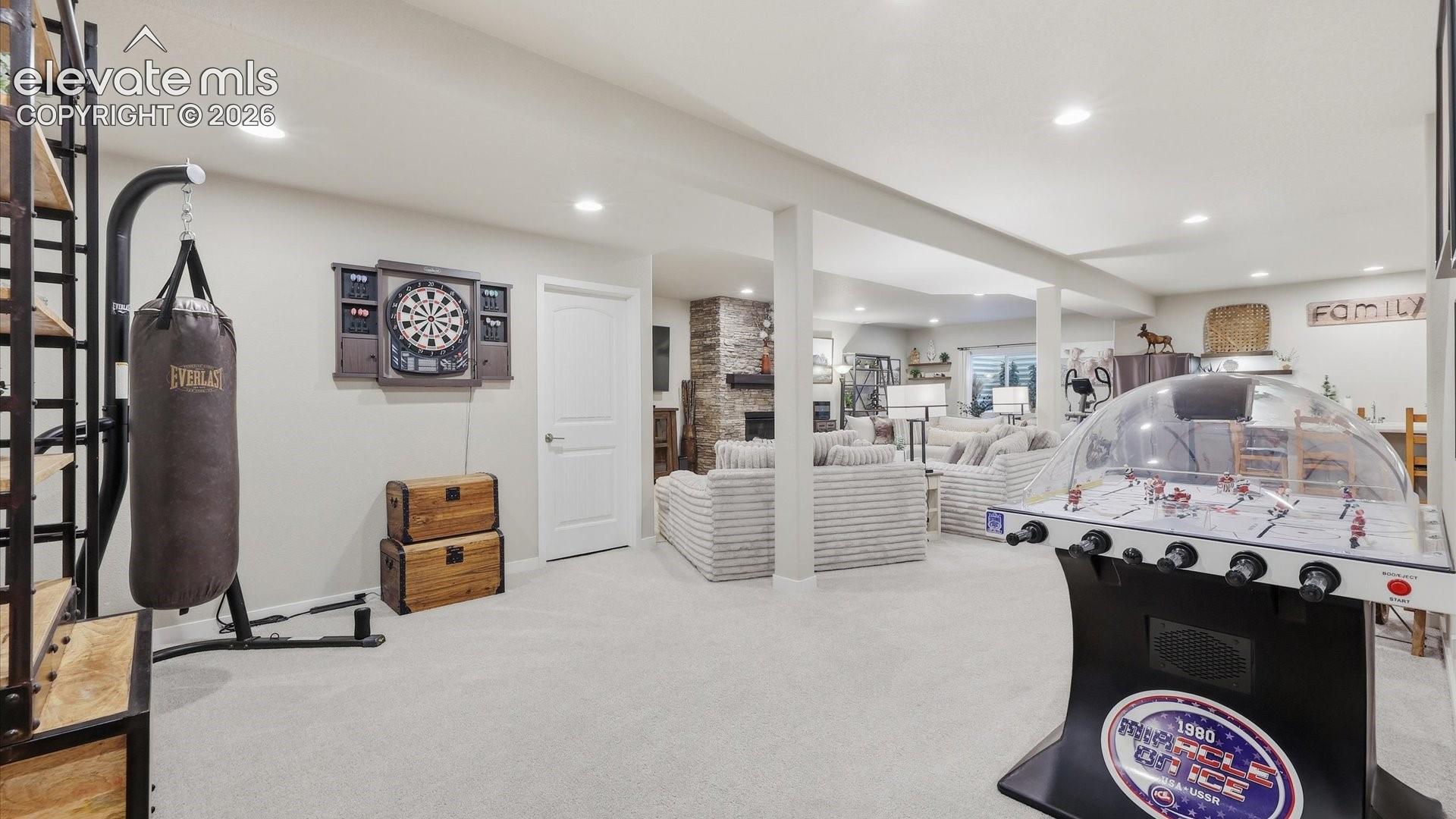 THE ULTIMATE GAME ZONE — Designed for fun and flexibility, this spacious lower-level bonus area is ready for game nights, friendly competition, and memorable gatherings.