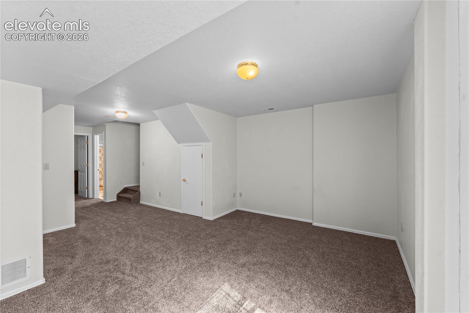 Open floor plan with plush carpeting