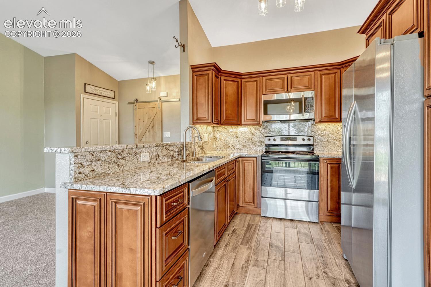 Stainless steel appliances and tile floor