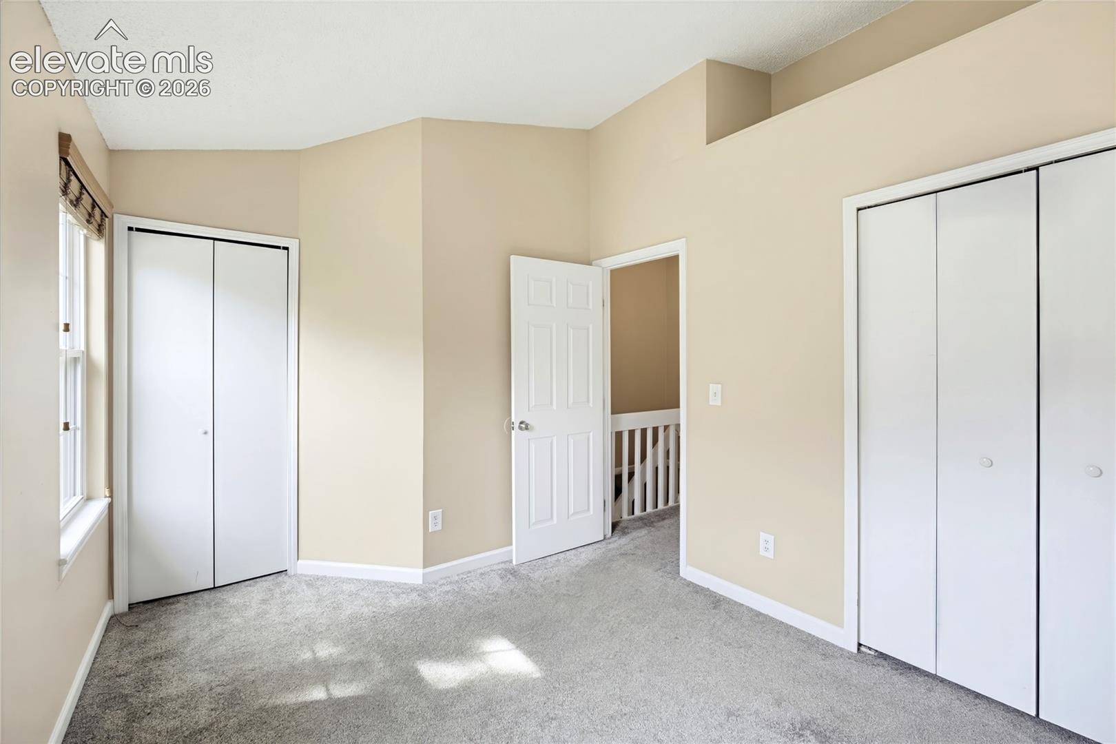 The Upper Level Bedroom #2 has neutral carpet, and double closets.