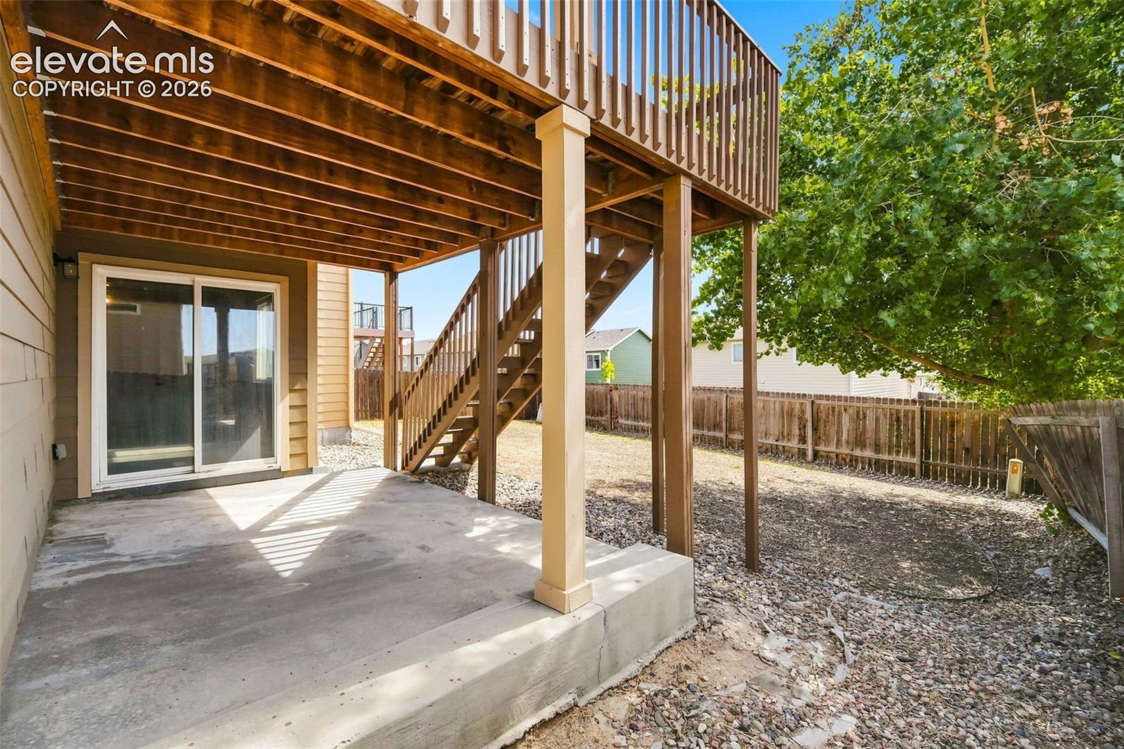 Concrete patio with direct access to a sliding glass door