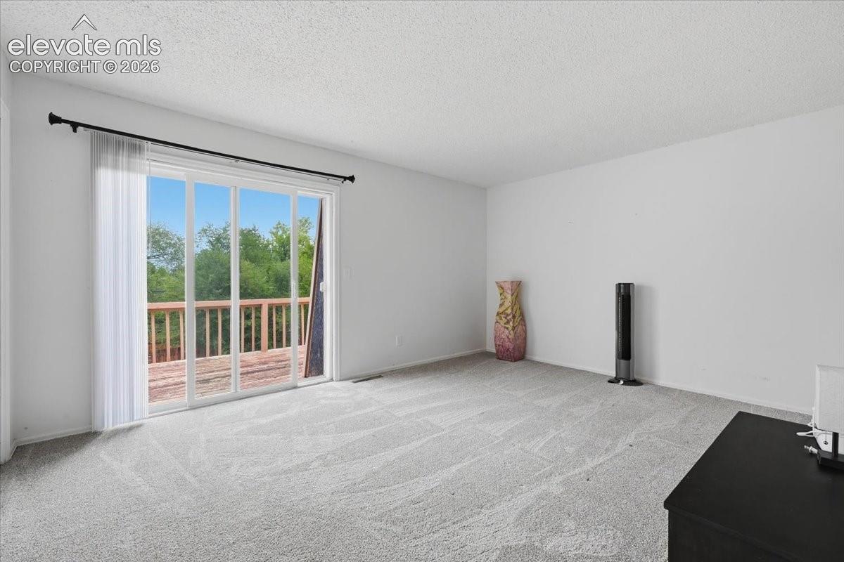 Unit 724 - Primary Bedroom with Walk-out to Private Deck