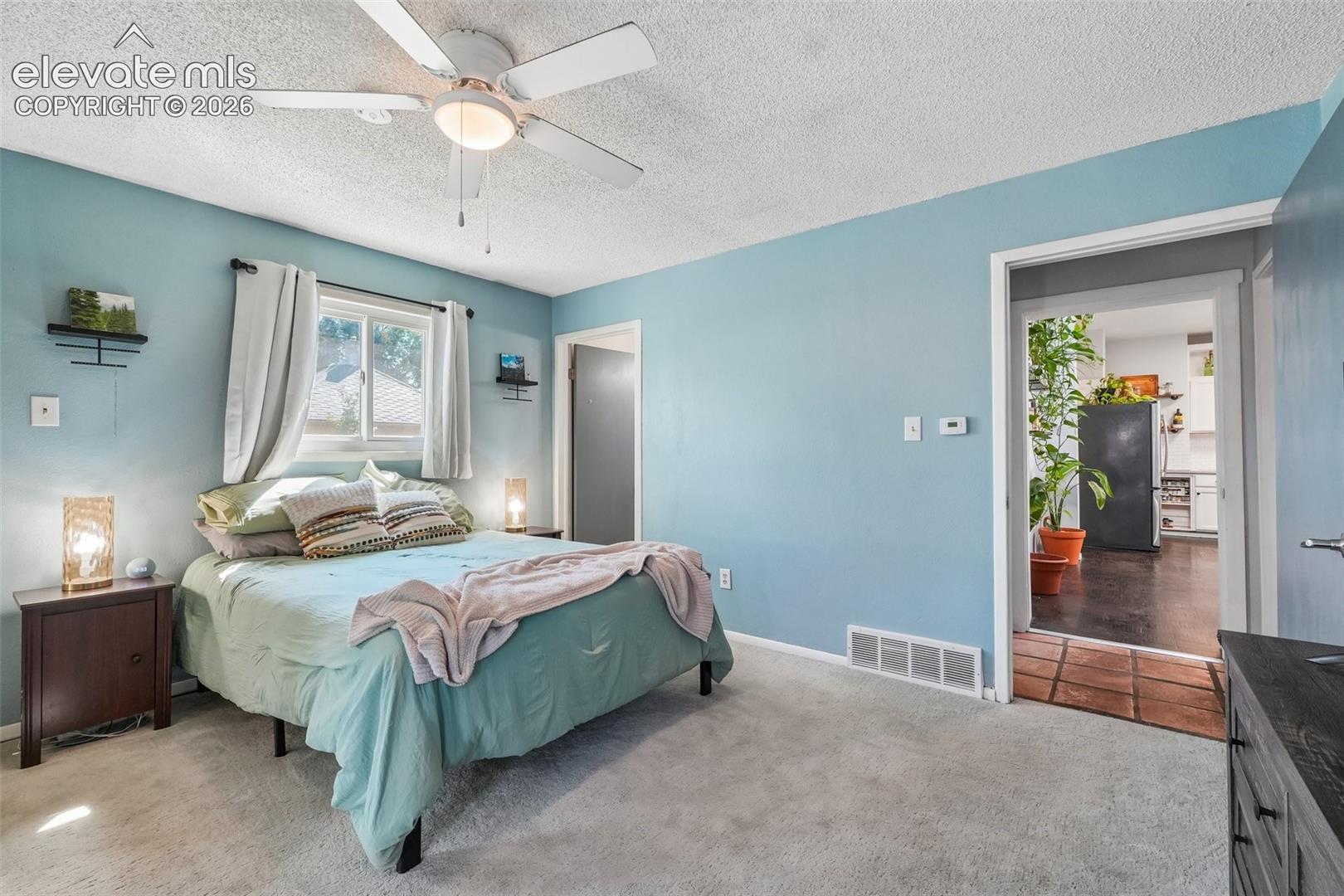 Primary bedroom with 3/4 en suite and a walk out to private deck