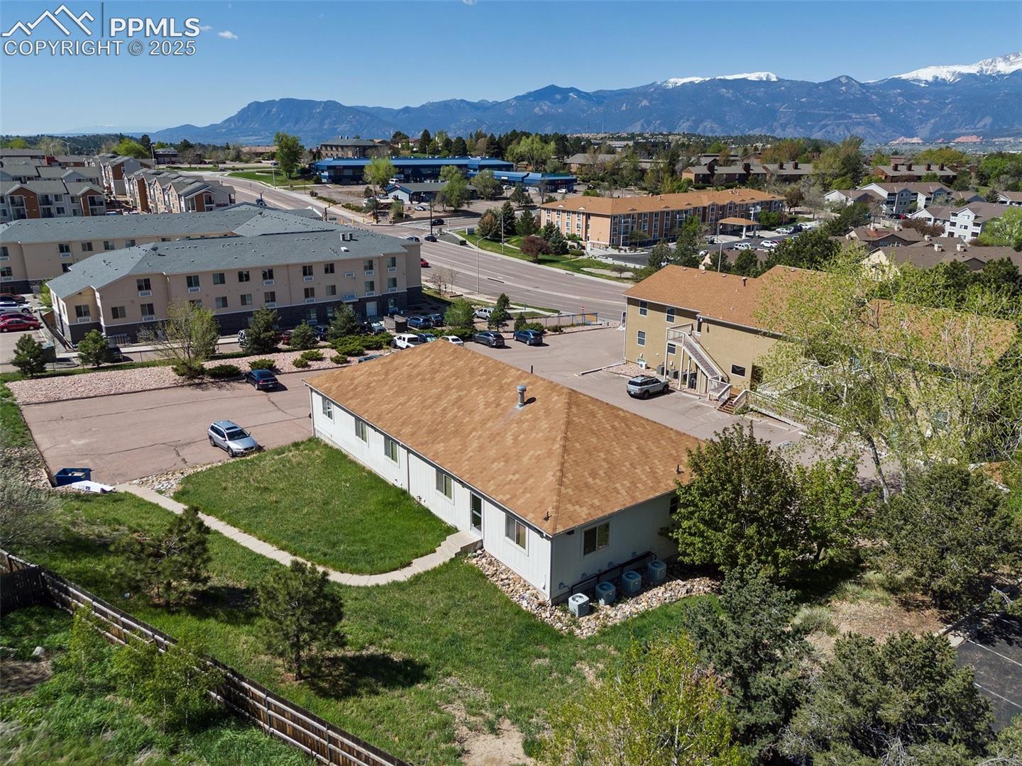 Aerial view of residential area with a mountain backdrop