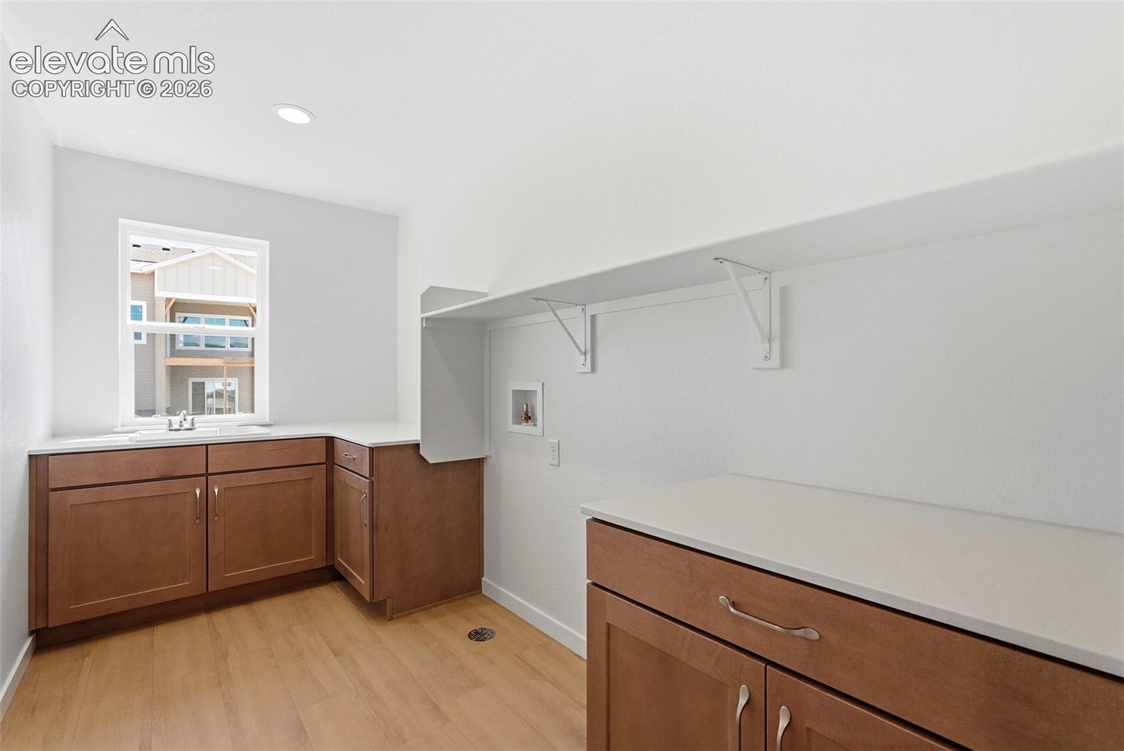 Spacious Laundry Room located on the upper level