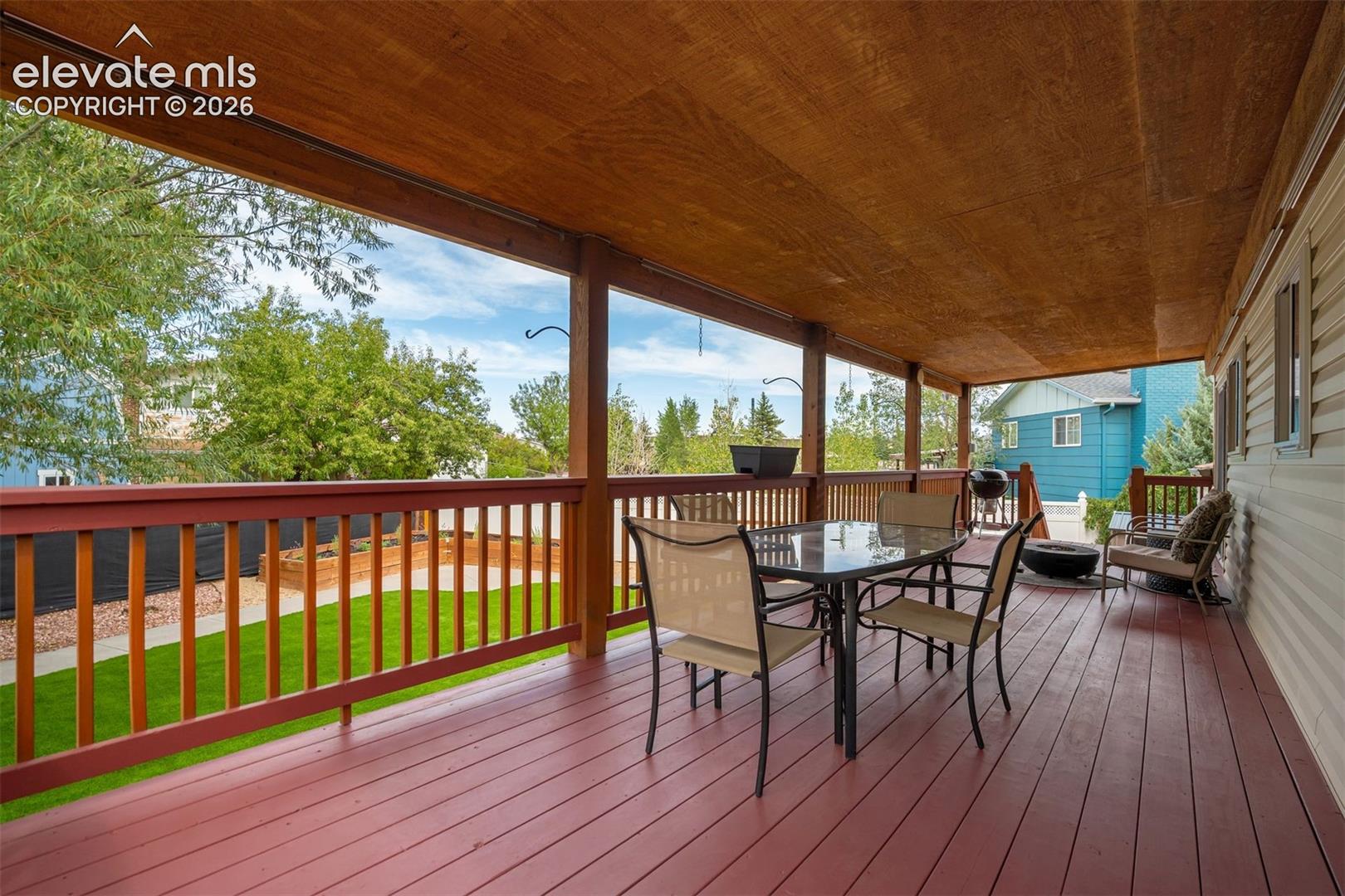This deck runs the entire length of the house because apparently “a little outdoor space” wasn't enough.