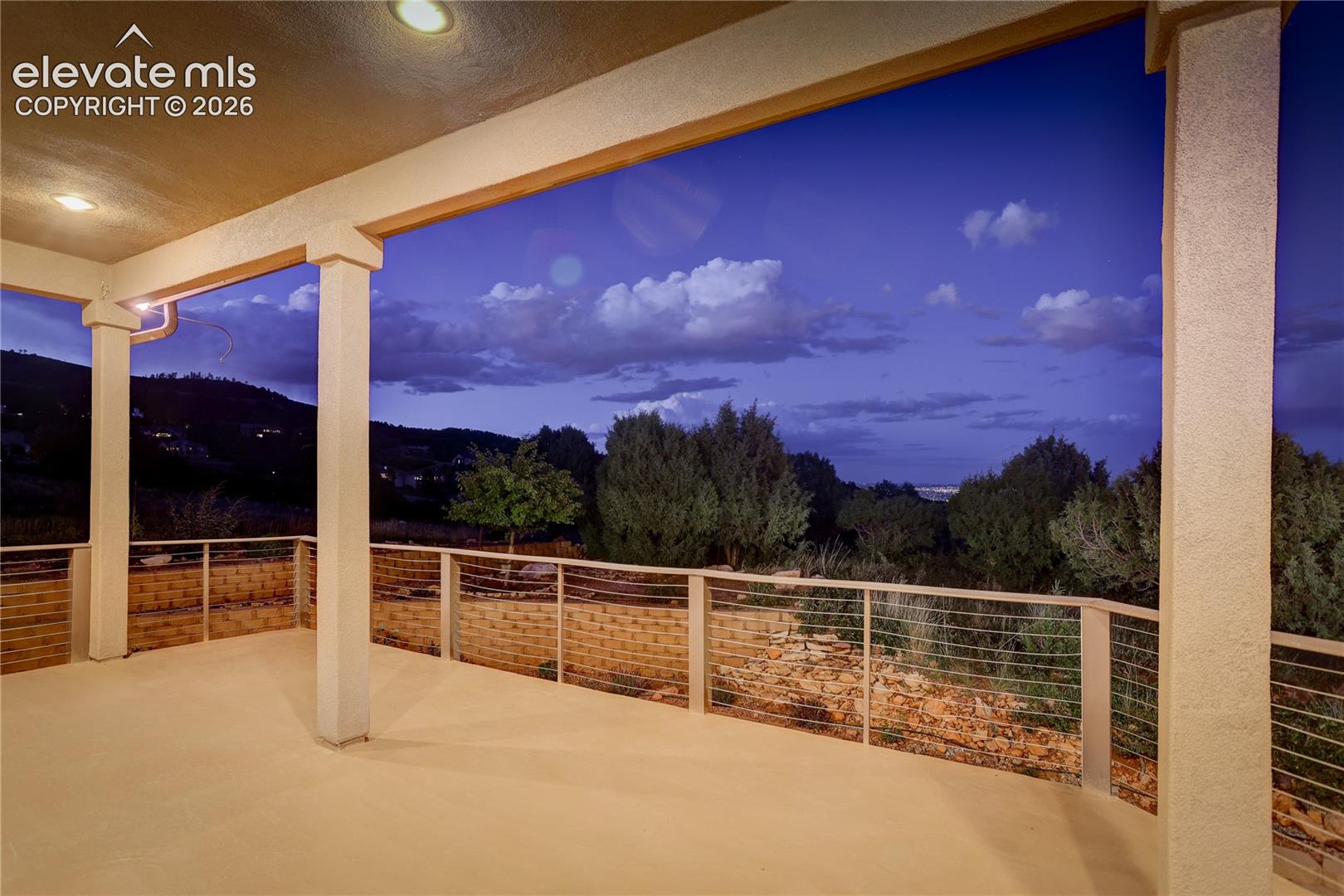 Main level, covered deck with views east over the city