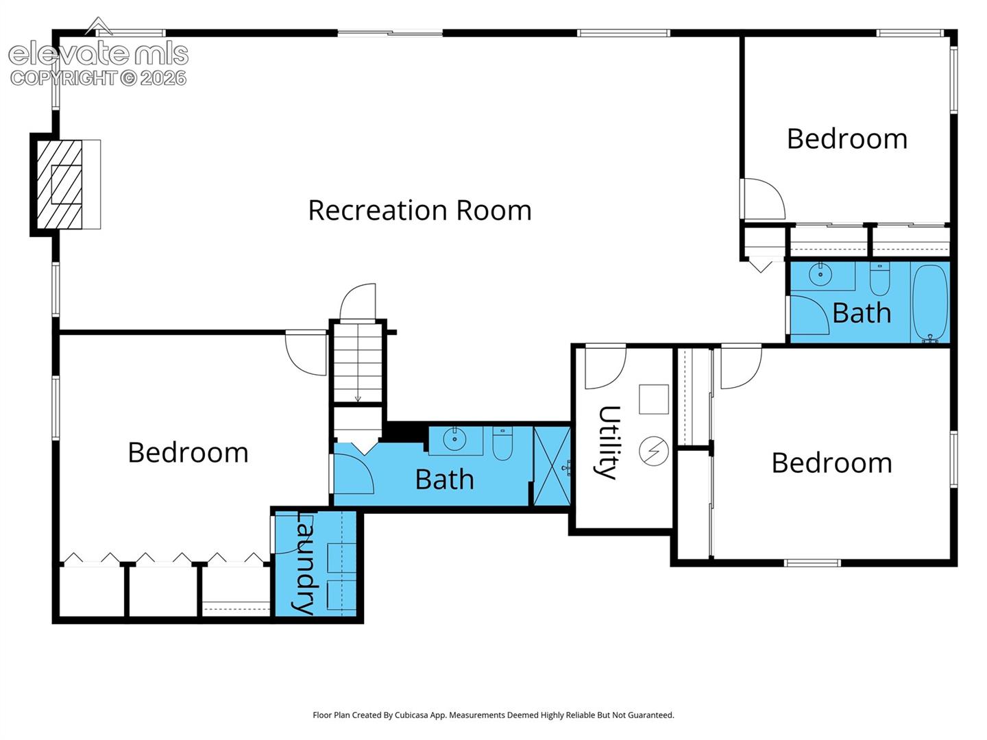 Full walkout basement floor plan featuring an expansive recreation room with gas-log fireplace, two bedrooms, and a separate bedroom suite with its own full bathroom, generous closet space, and private laundry room.