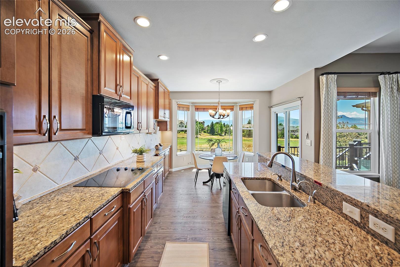 Kitchen with Nook faces west, the golf course and the mountains