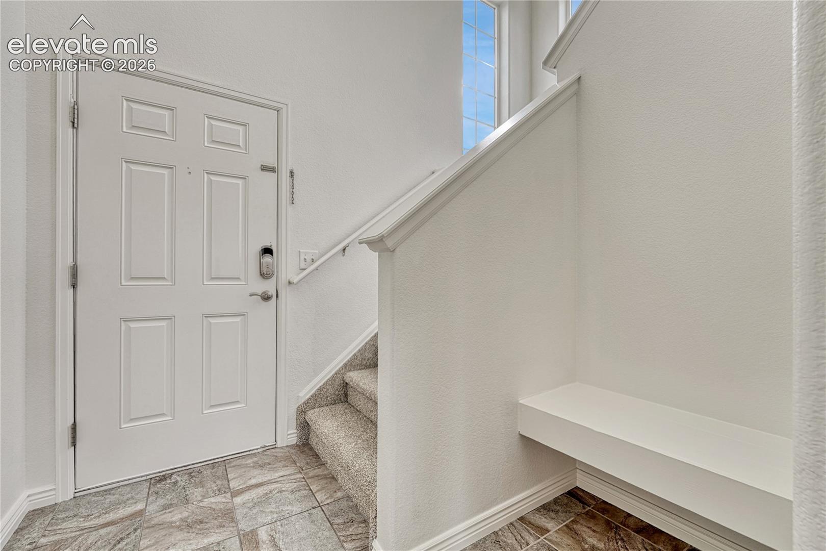 Convenient built-in bench and new carpet on the stairs and upper level. 