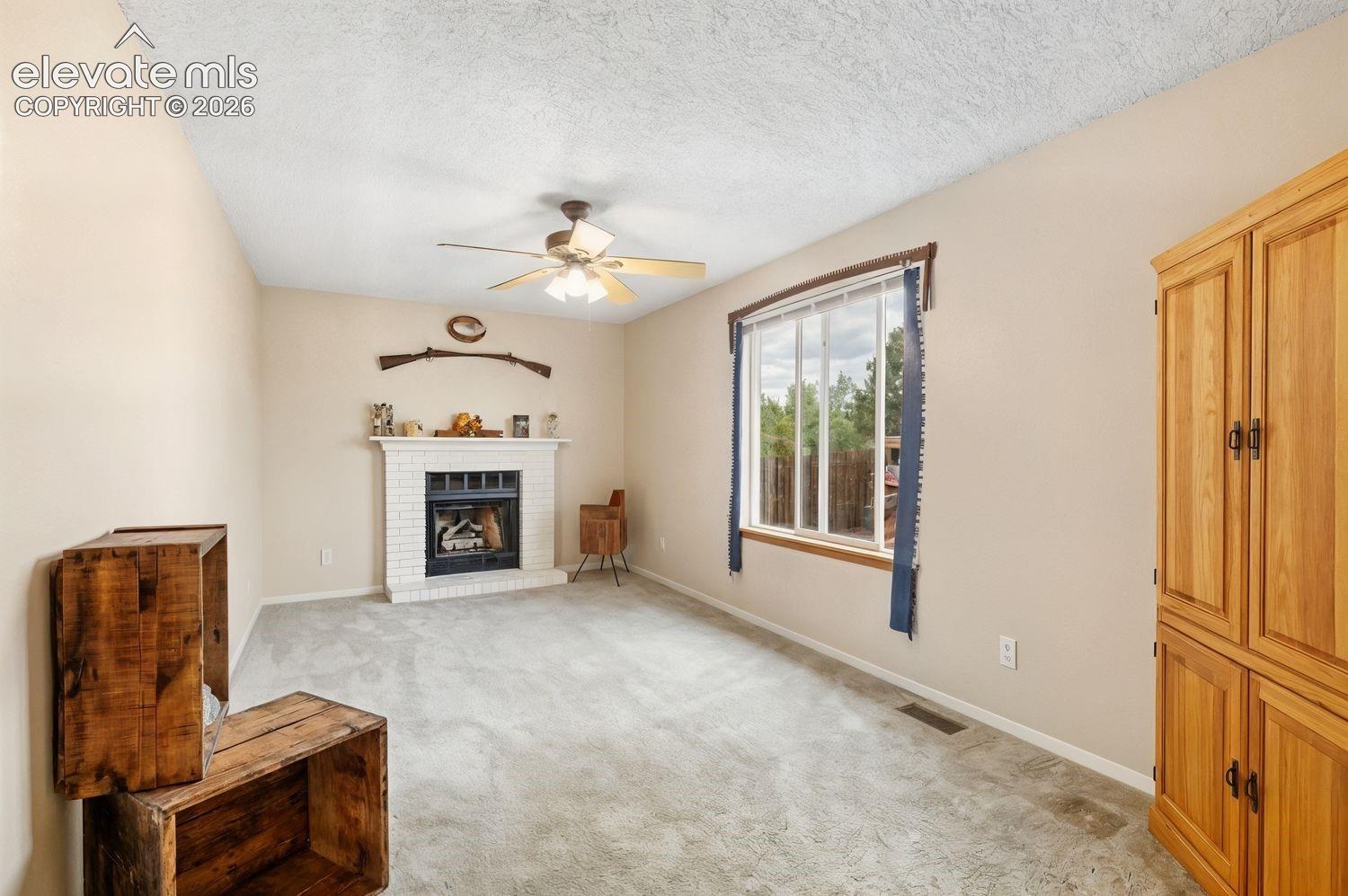 Cozy up by the fireplace in the family room