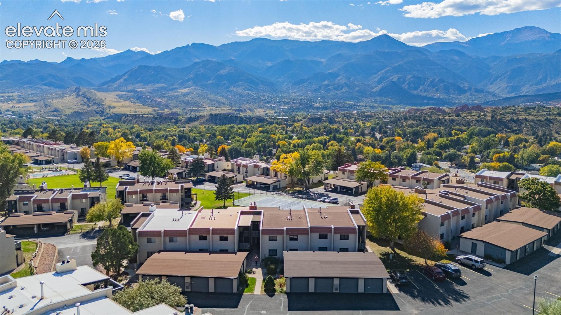 Expansive property featuring multiple residential buildings, surface parking areas, and mature landscaping