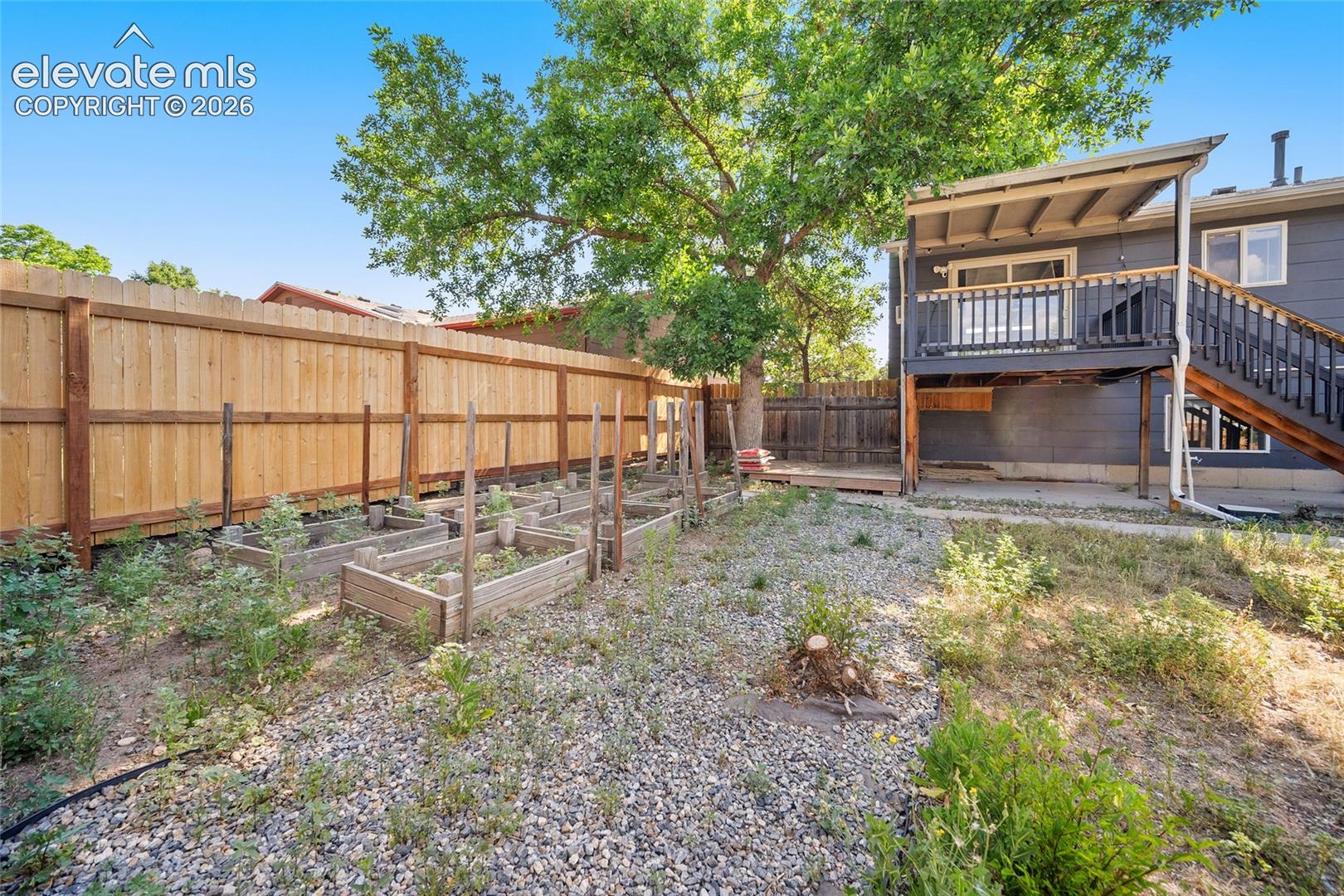 A serene area to garden and view of the back of the home. 