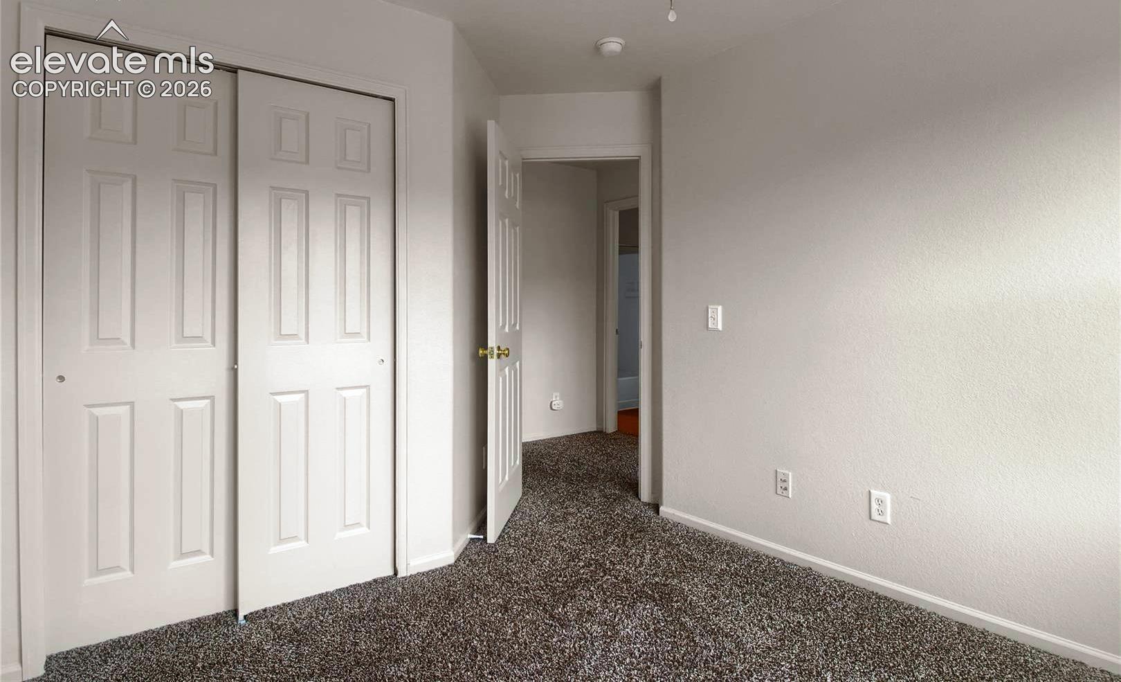 When vacant bedroom 2 facing closet and hallway