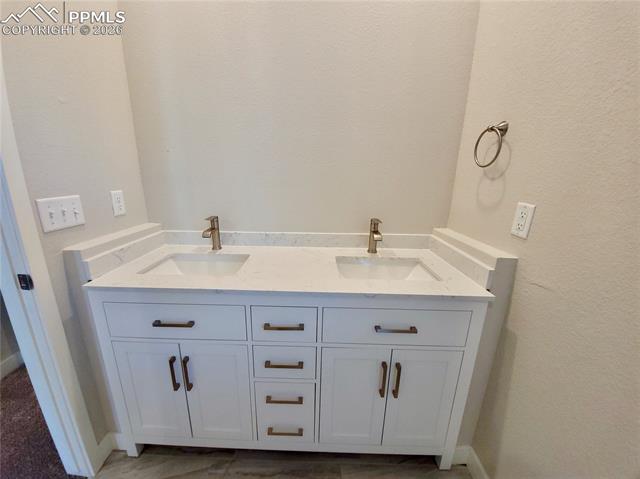 Double vanity with quartz counters and undermount sinks