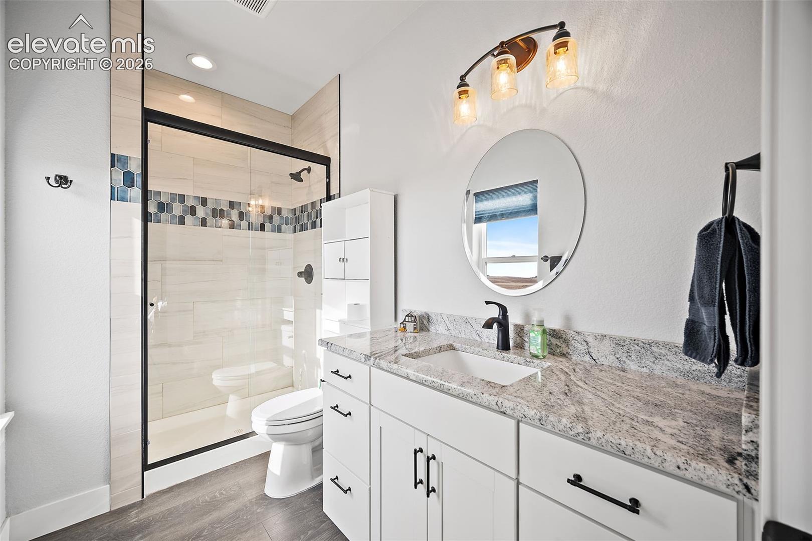 Private bath in main level bedroom
