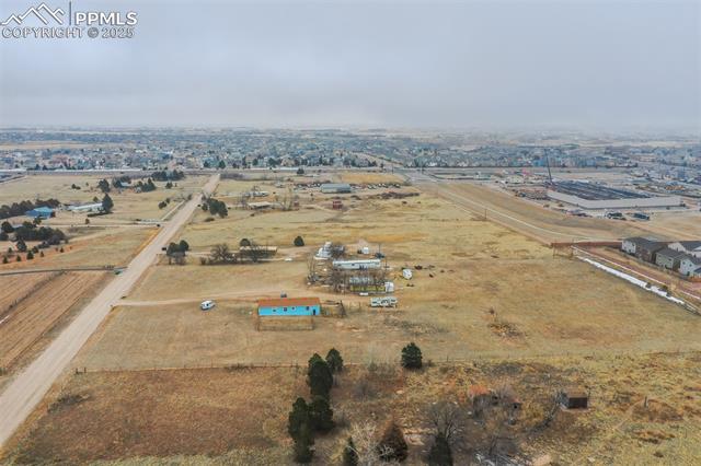 Aerial view of property's location featuring an industrial area