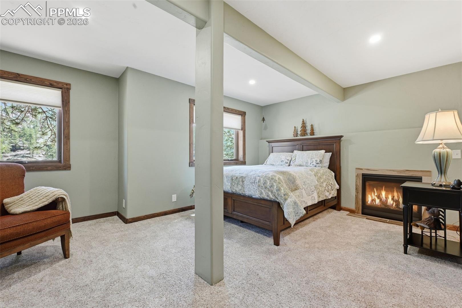 Newly refinished garden level offers a reading nook and a propane fireplace. 