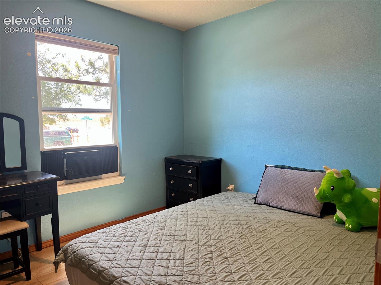 bedroom with laminate flooring