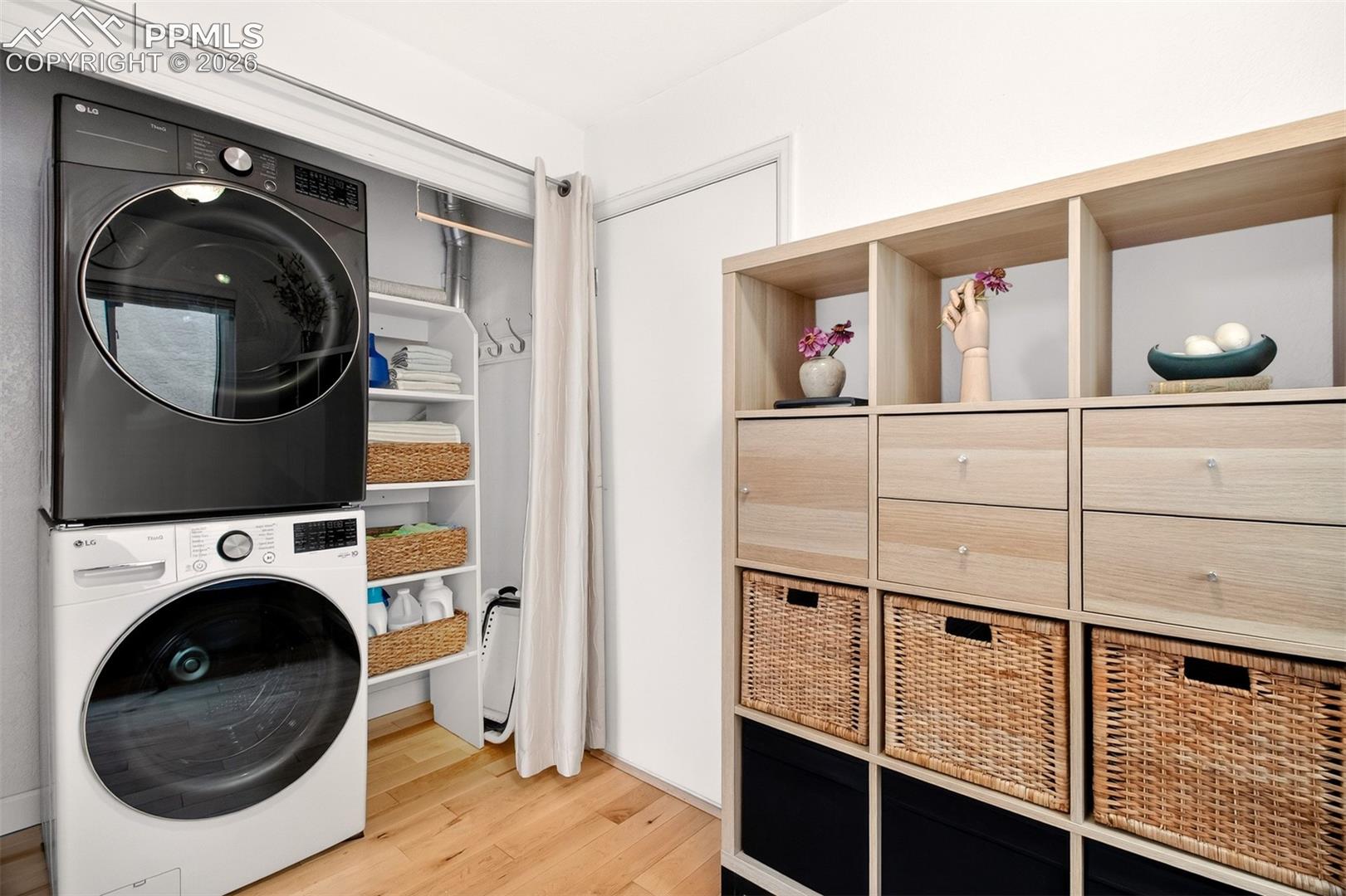 Laundry area with additional shelving.
