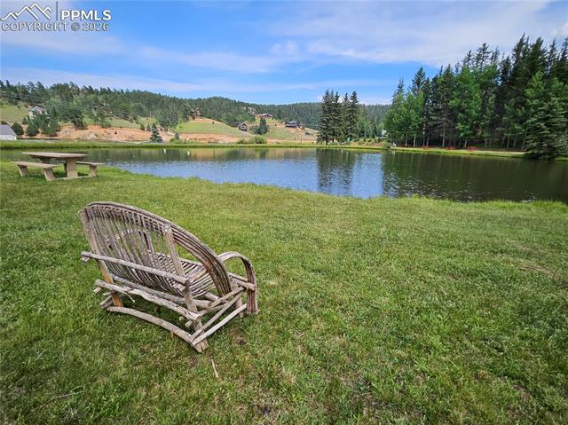 Bench Overlooking Community Pond. 