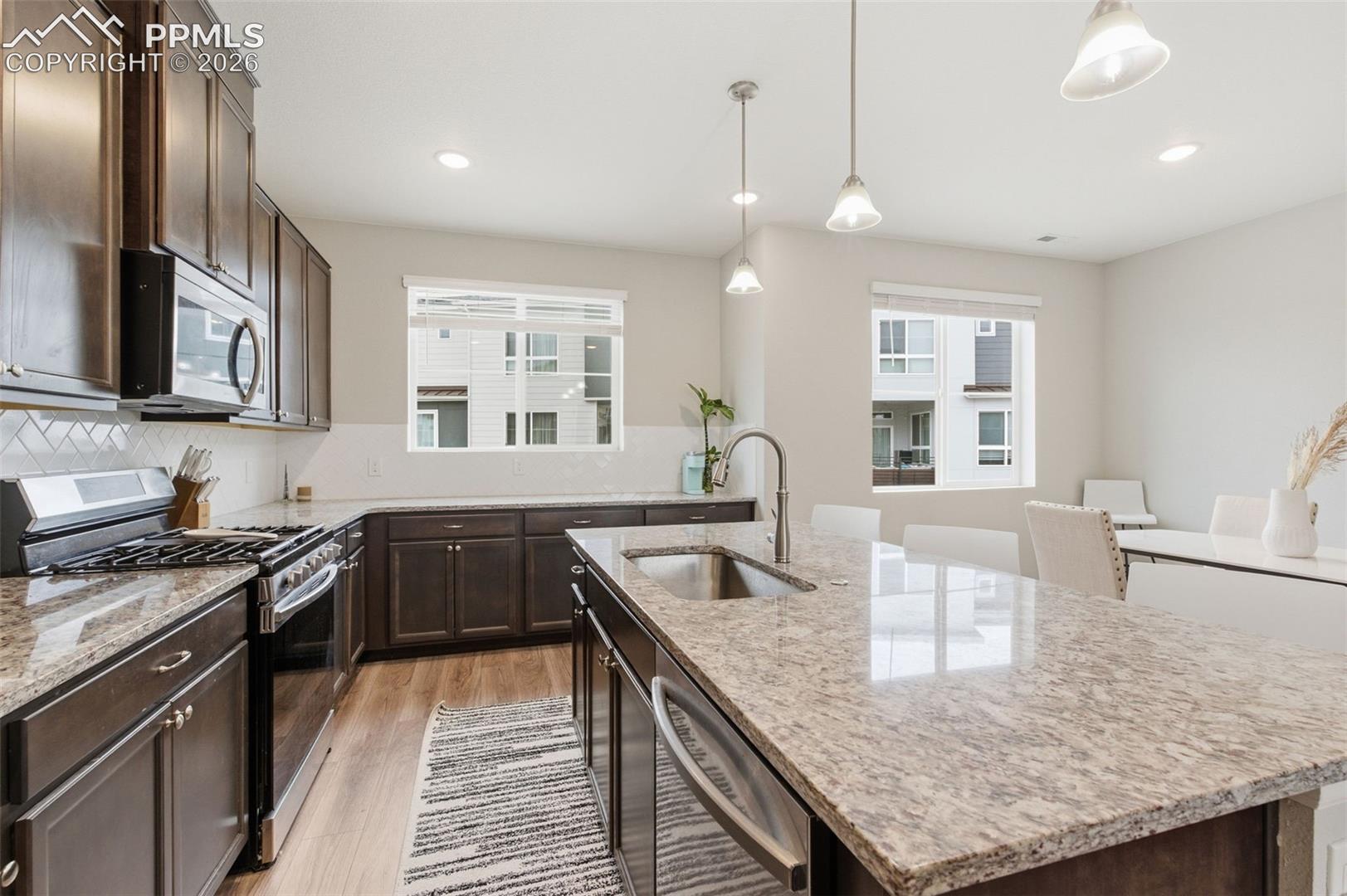 All stainless appliances are included with gas range and washer dryer conveniently located near upstairs bedrooms