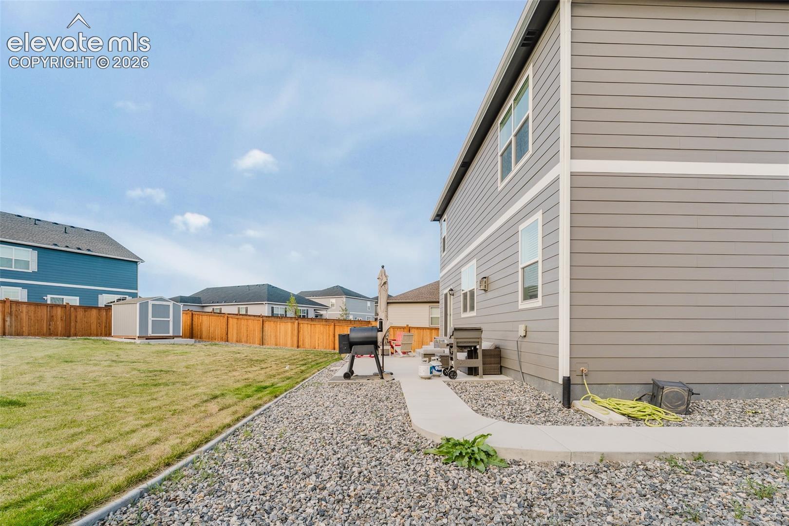 View of fenced backyard.